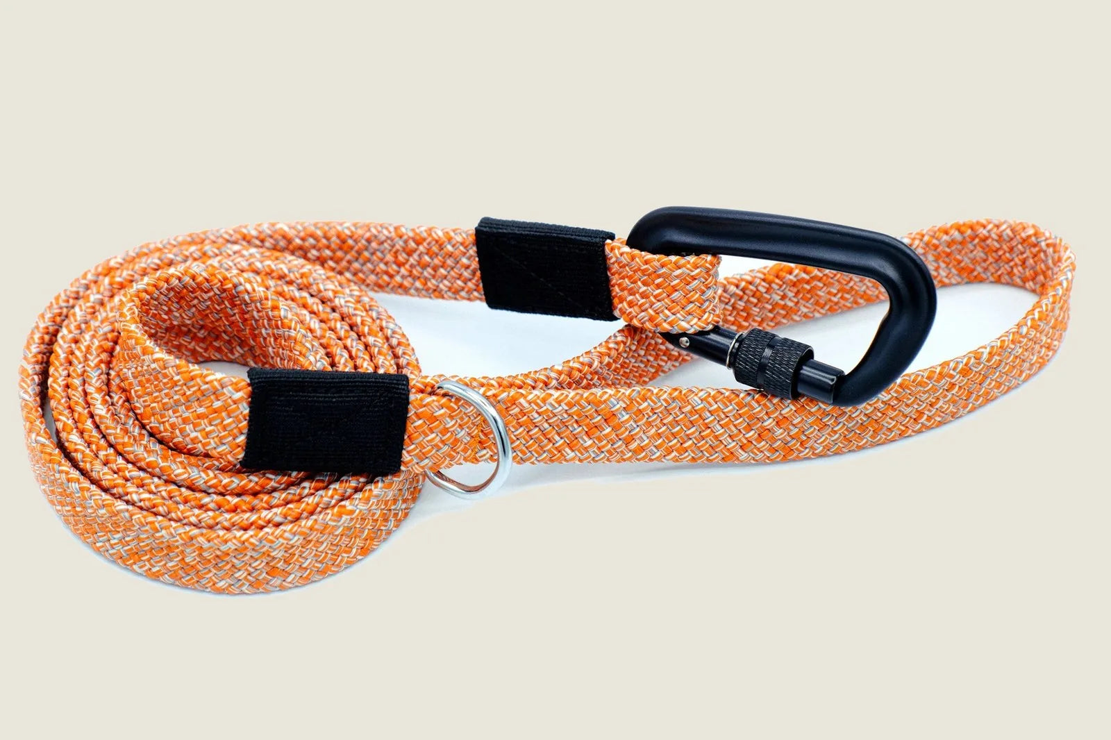 Durable nylon dog leash in orange and white pattern, featuring a secure aluminum carabiner and comfortable grip.