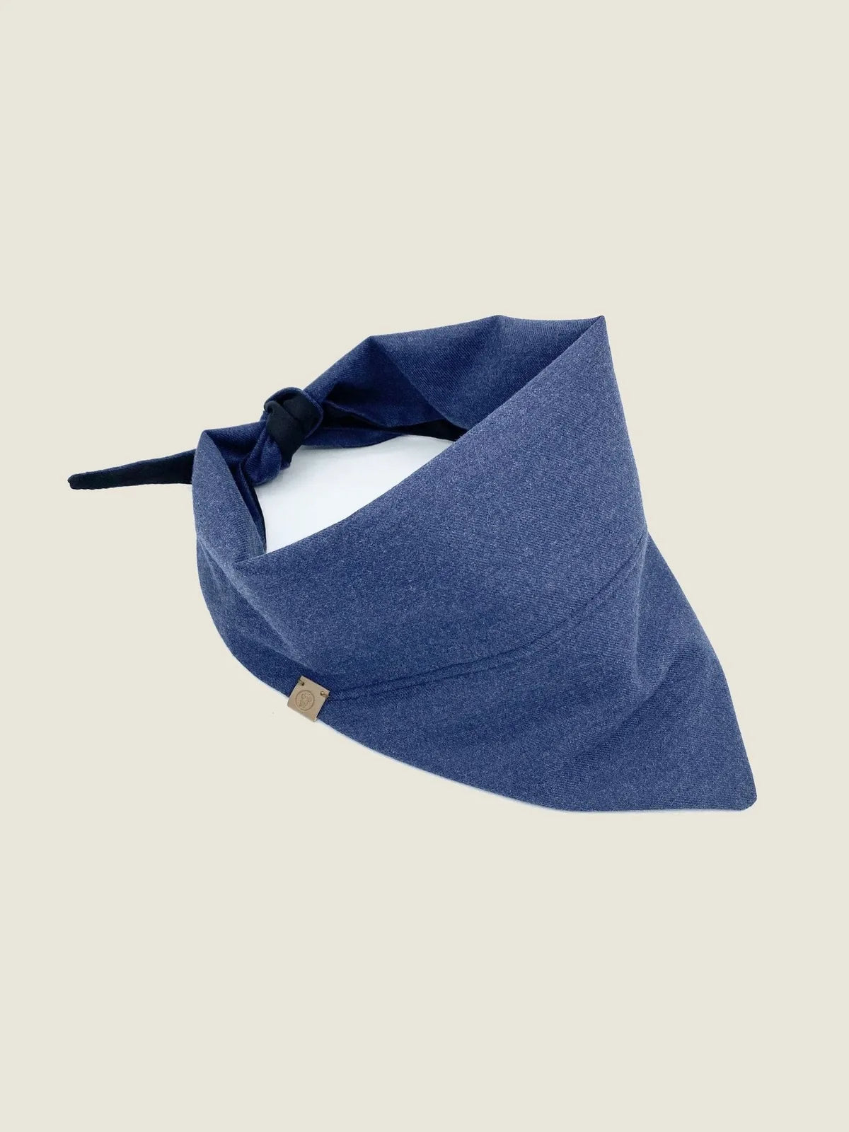 Reversible navy bandana for pets, crafted from soft cotton flannel, featuring a tie closure for a secure fit.