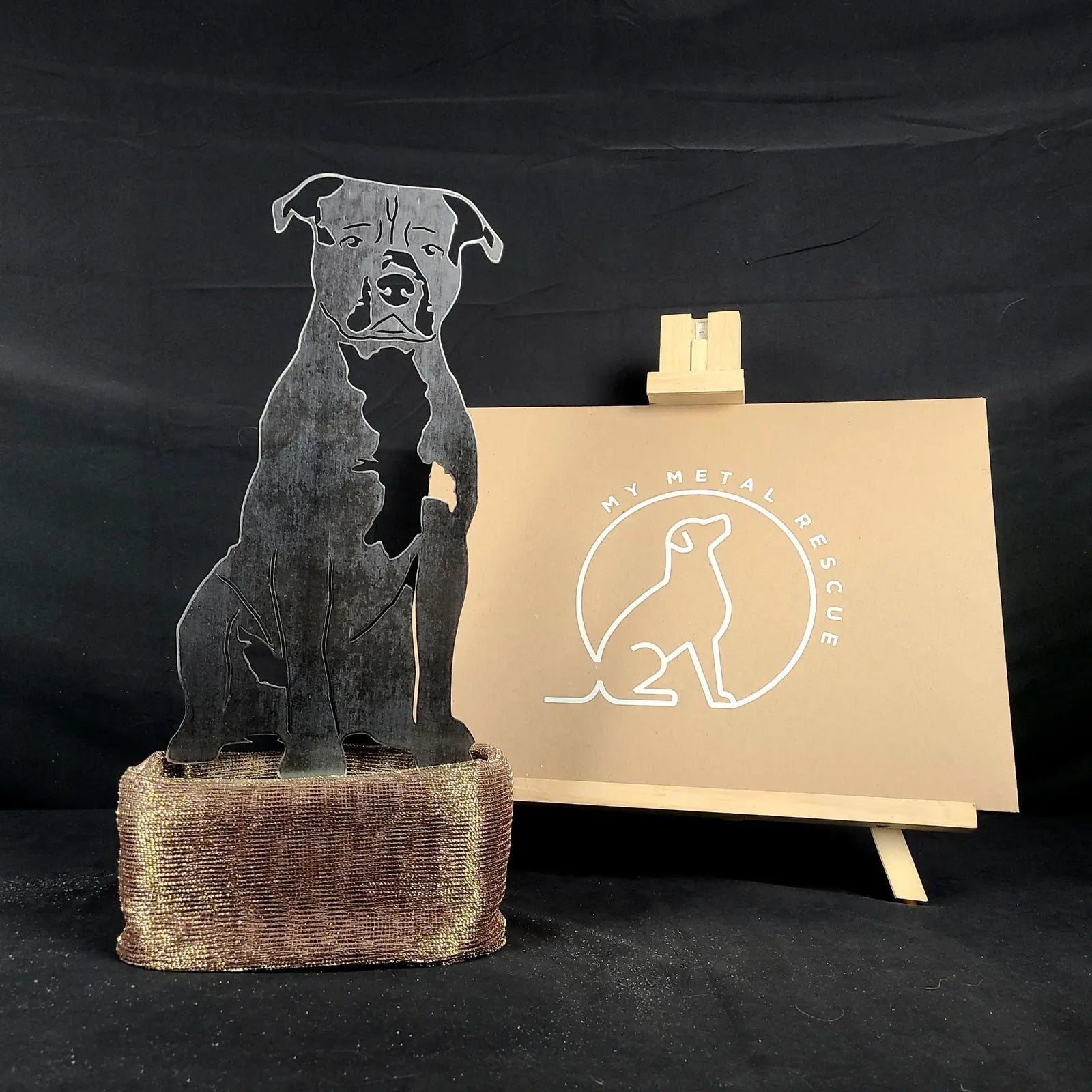Handcrafted American Staffordshire Terrier metal art in dark steel with a rustic base, perfect for indoor or outdoor décor.