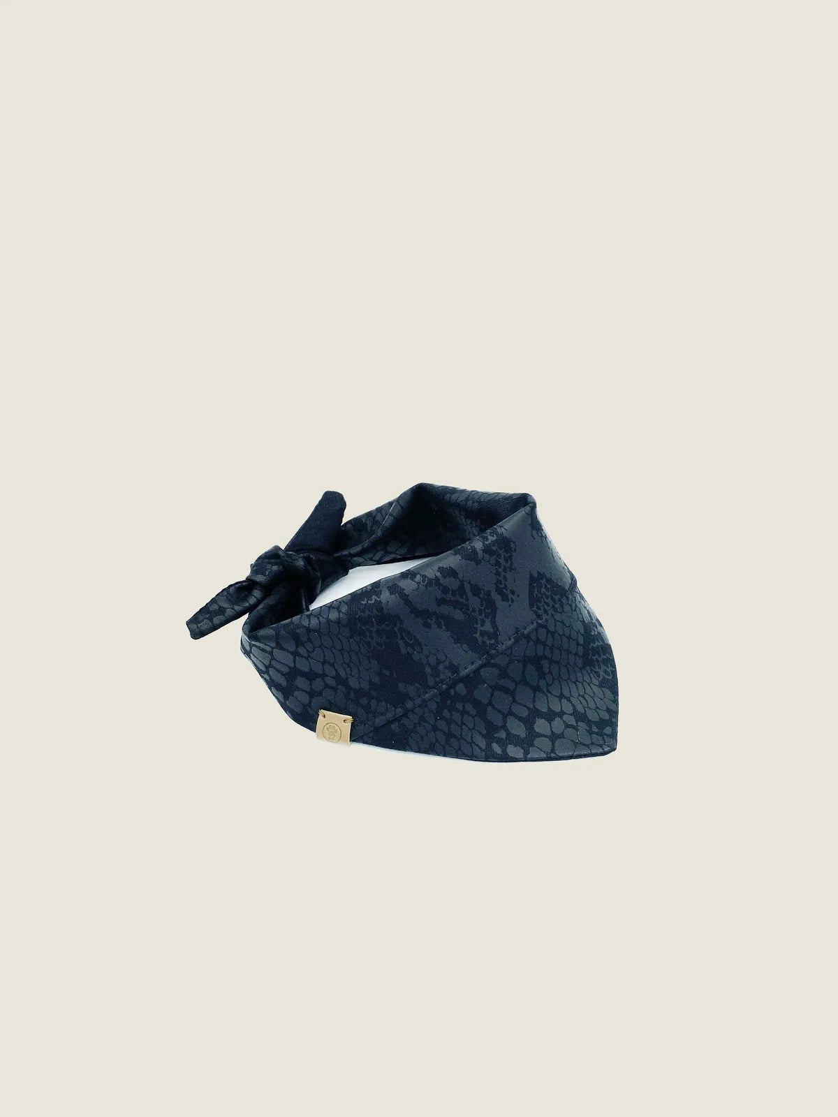 Reversible navy bandana featuring a stylish snake pattern, crafted from soft cotton with a tie-on design.