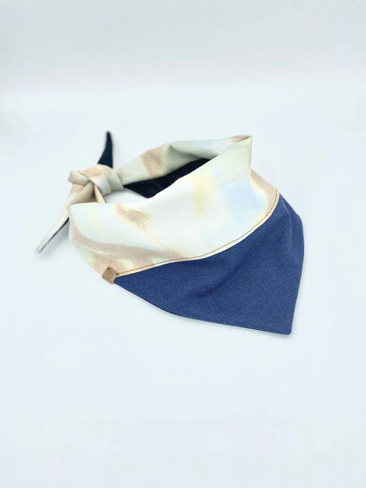 Reversible Aspen pet bandana in soft cotton, featuring a stylish cream, blue, and tan design with a tie closure.
