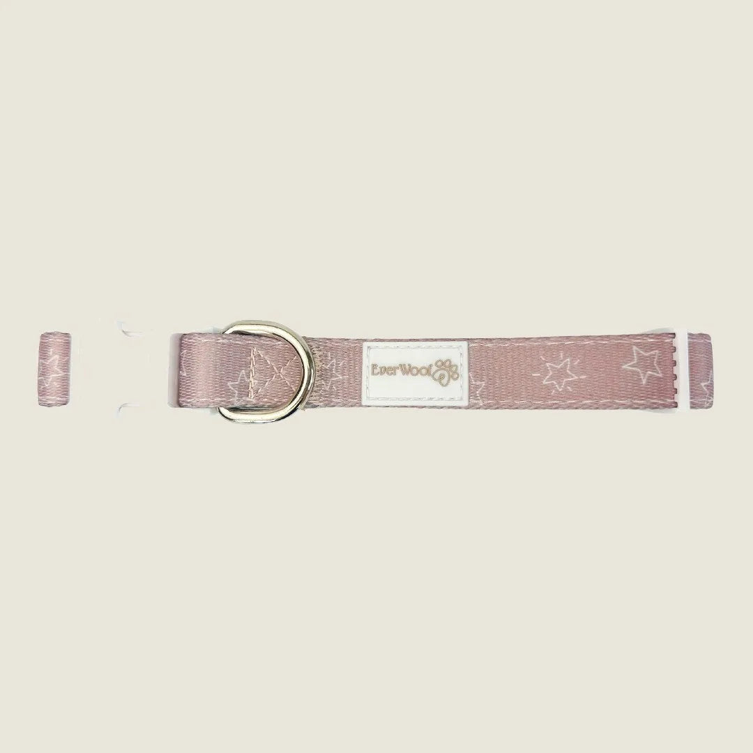 Adjustable pink dog collar with star pattern, neoprene padding, and gold D-ring from EverWoof. Perfect for casual walks.