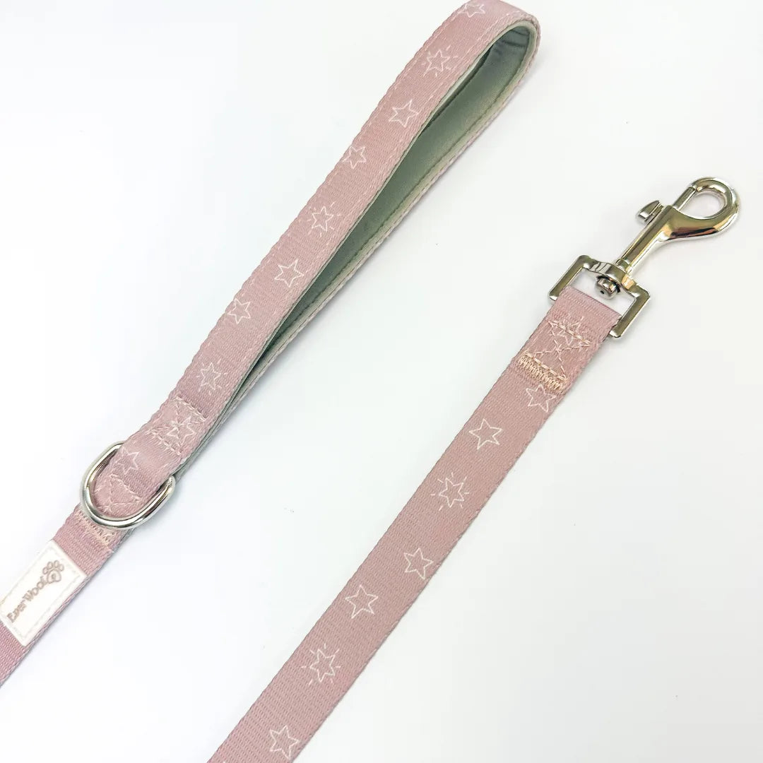 Asteria leash in soft pink with star pattern, featuring a neoprene padded handle and zinc alloy hook.