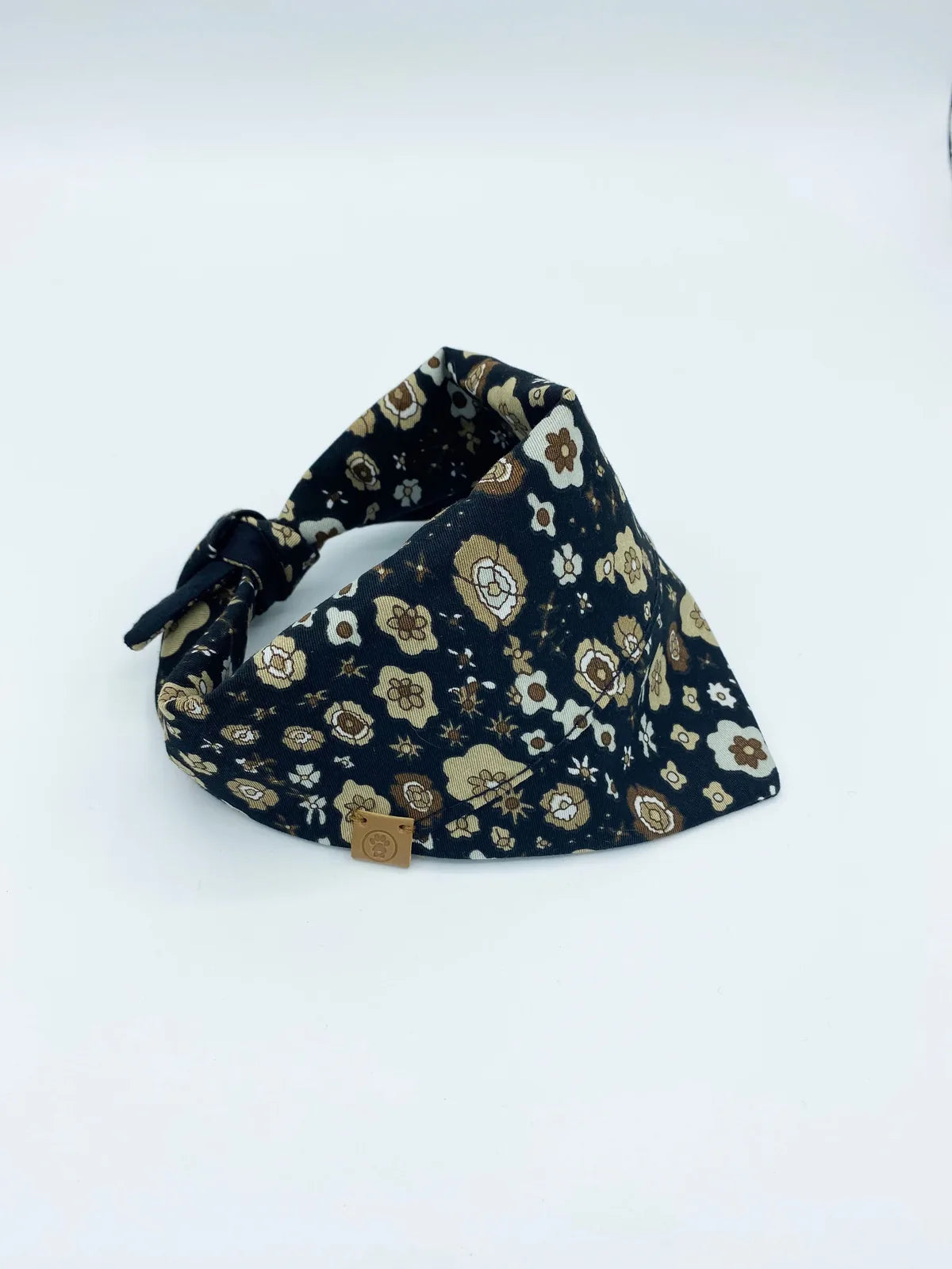 Reversible navy and floral pet bandana made from soft, durable cotton, featuring adjustable tie-on style.
