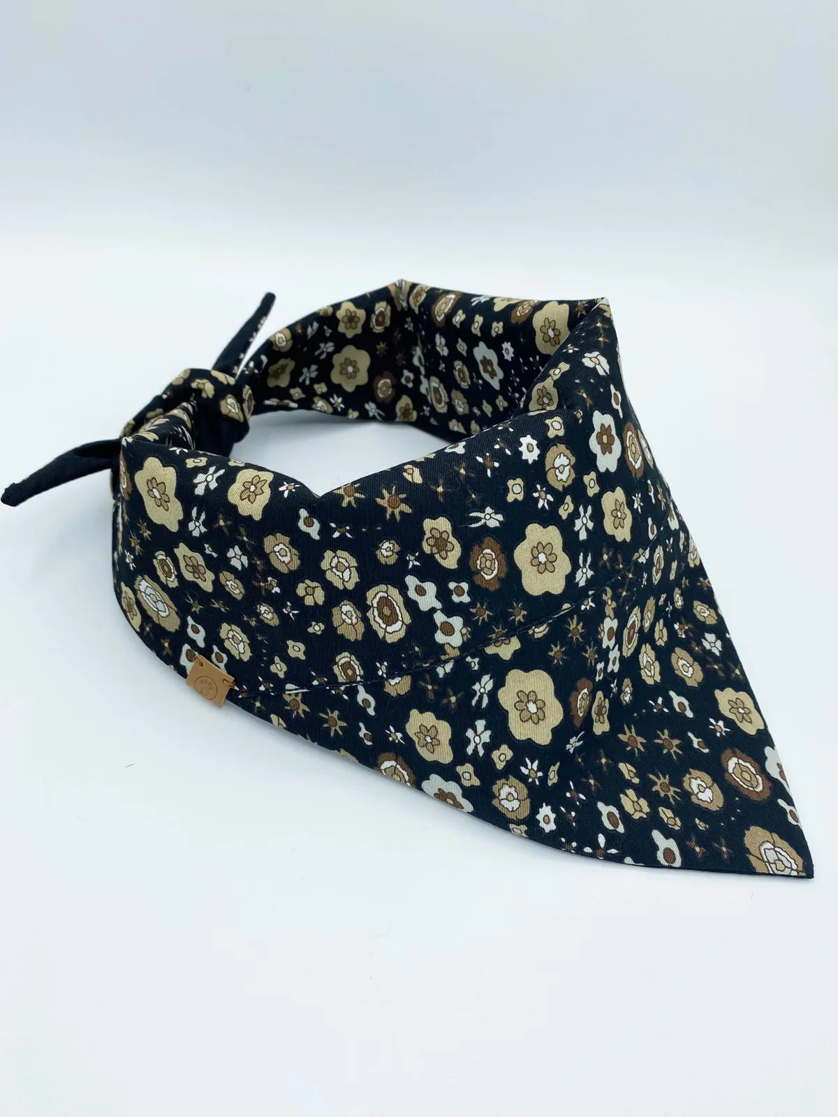 Avery reversible pet bandana in black with floral patterns in brown and cream, crafted from soft cotton for pets.