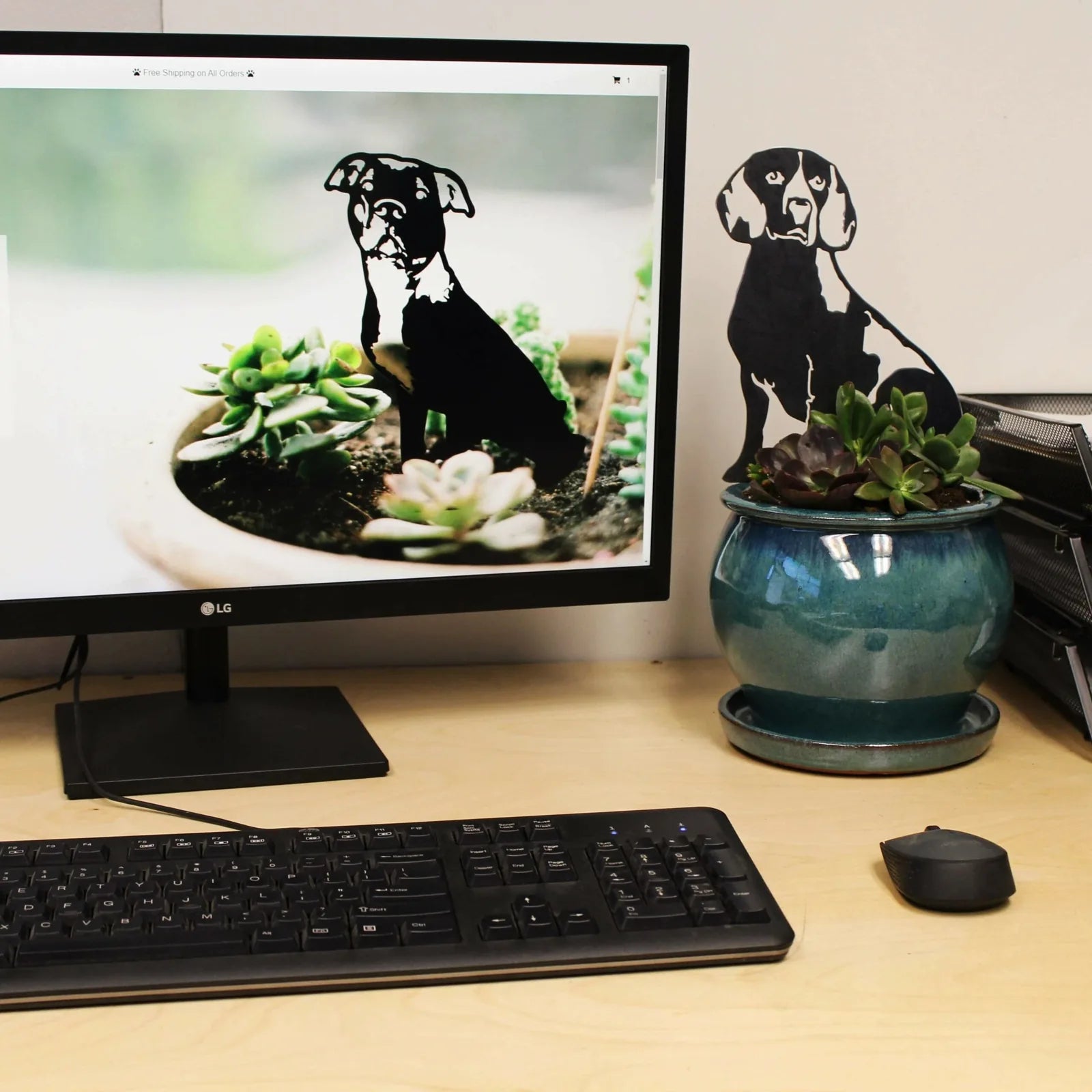Black Beagle silhouette by My Metal Rescue beside a succulent plant in a pot, enhancing a stylish workspace.