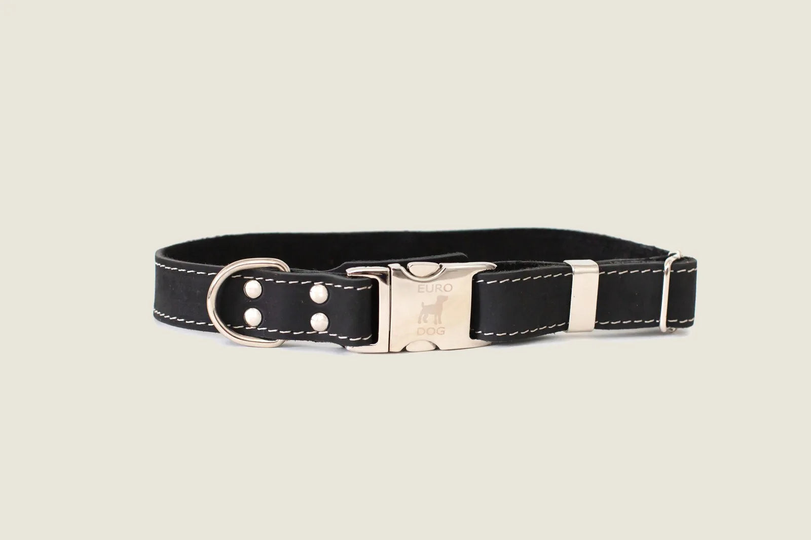 Midnight black leather dog collar featuring a quick-release metal buckle and steel D-ring for leash attachment.