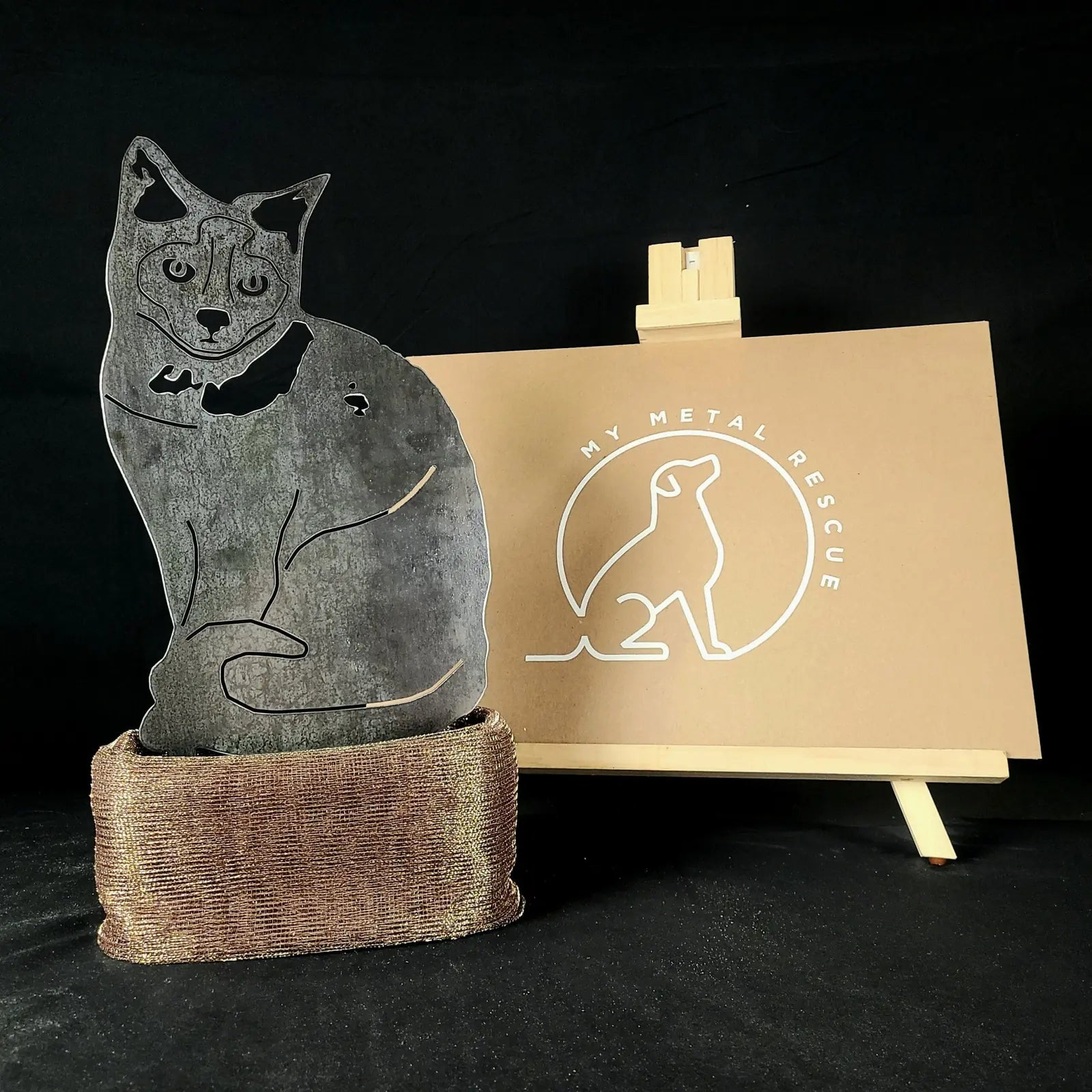 Birman metal silhouette in Corten steel with a brown base, displayed next to a My Metal Rescue sign.