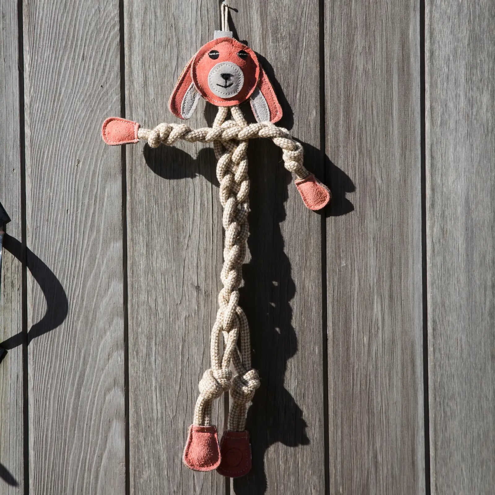 Large Bitsy Bunny rope dog toy with a knotted design, featuring a soft orange face and sturdy cotton rope construction.