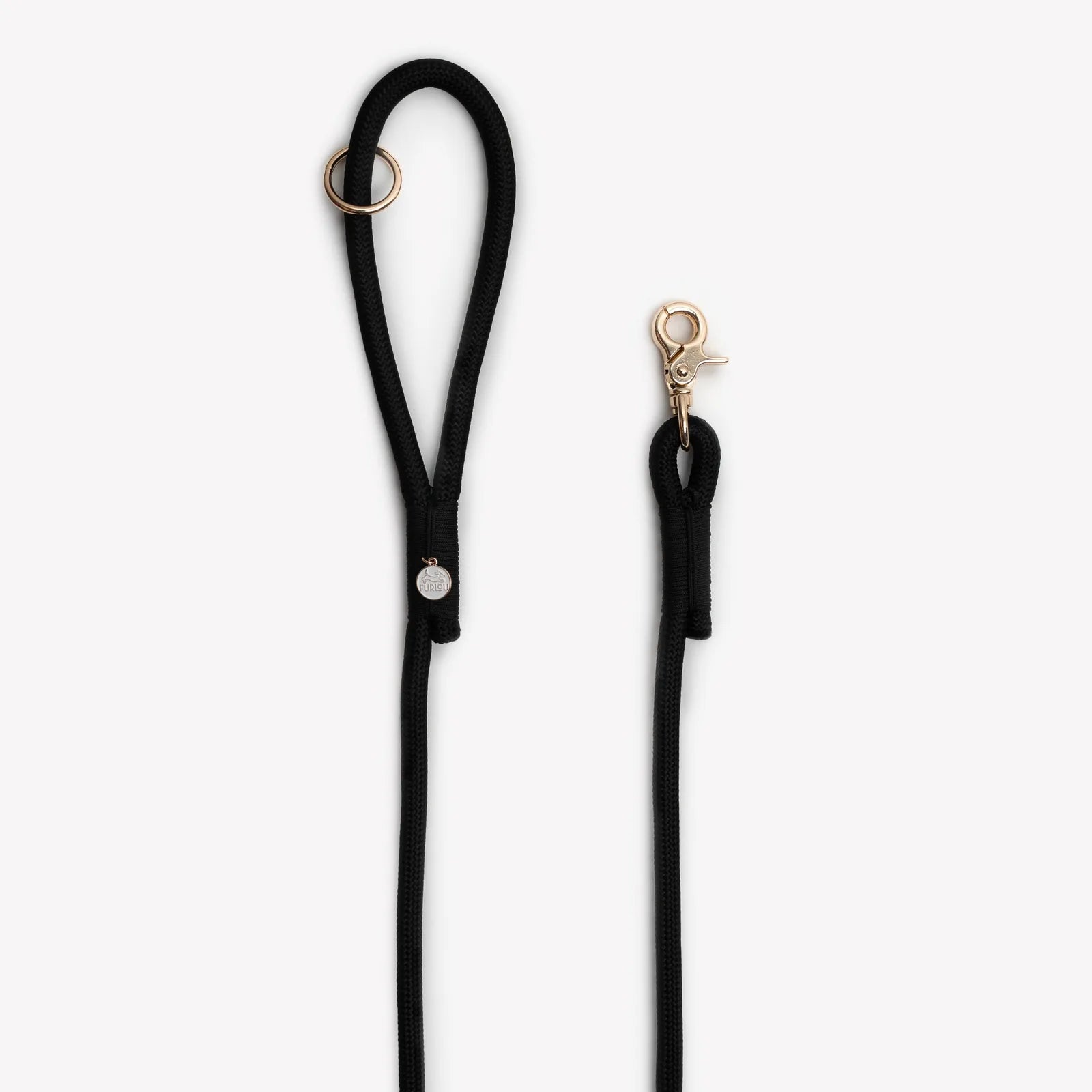 Braided black nylon dog leash with a gold clip and O-ring for accessories, ideal for everyday walking.