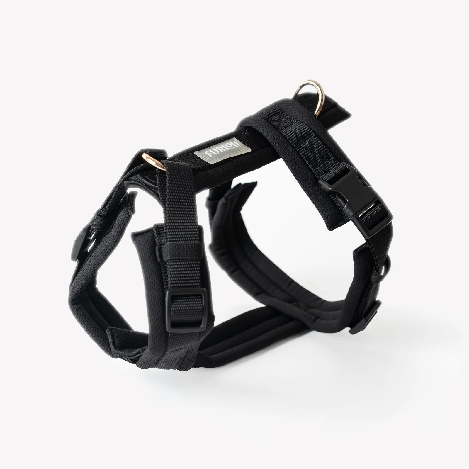 Black Comfort Dog Harness by FURLOU featuring adjustable straps, breathable padding, and gold hardware details.