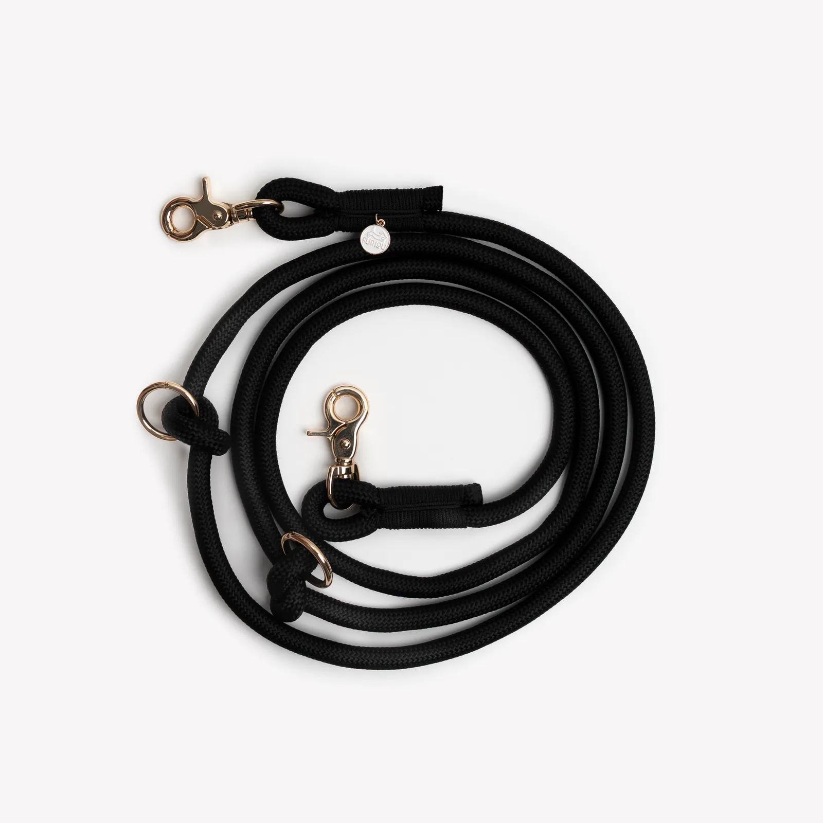 Hands-free black braided leash by FURLOU with gold hardware, designed for versatile dog walking.