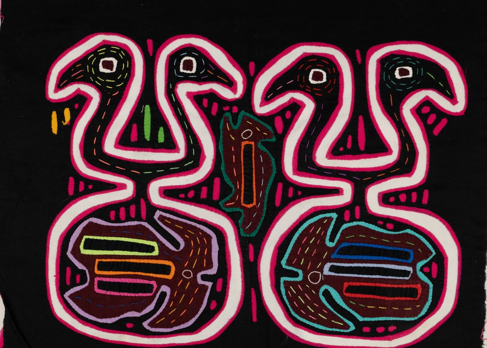 Hand-stitched black tapestry featuring pink and multi-colored geometric designs of stylized birds and abstract shapes.