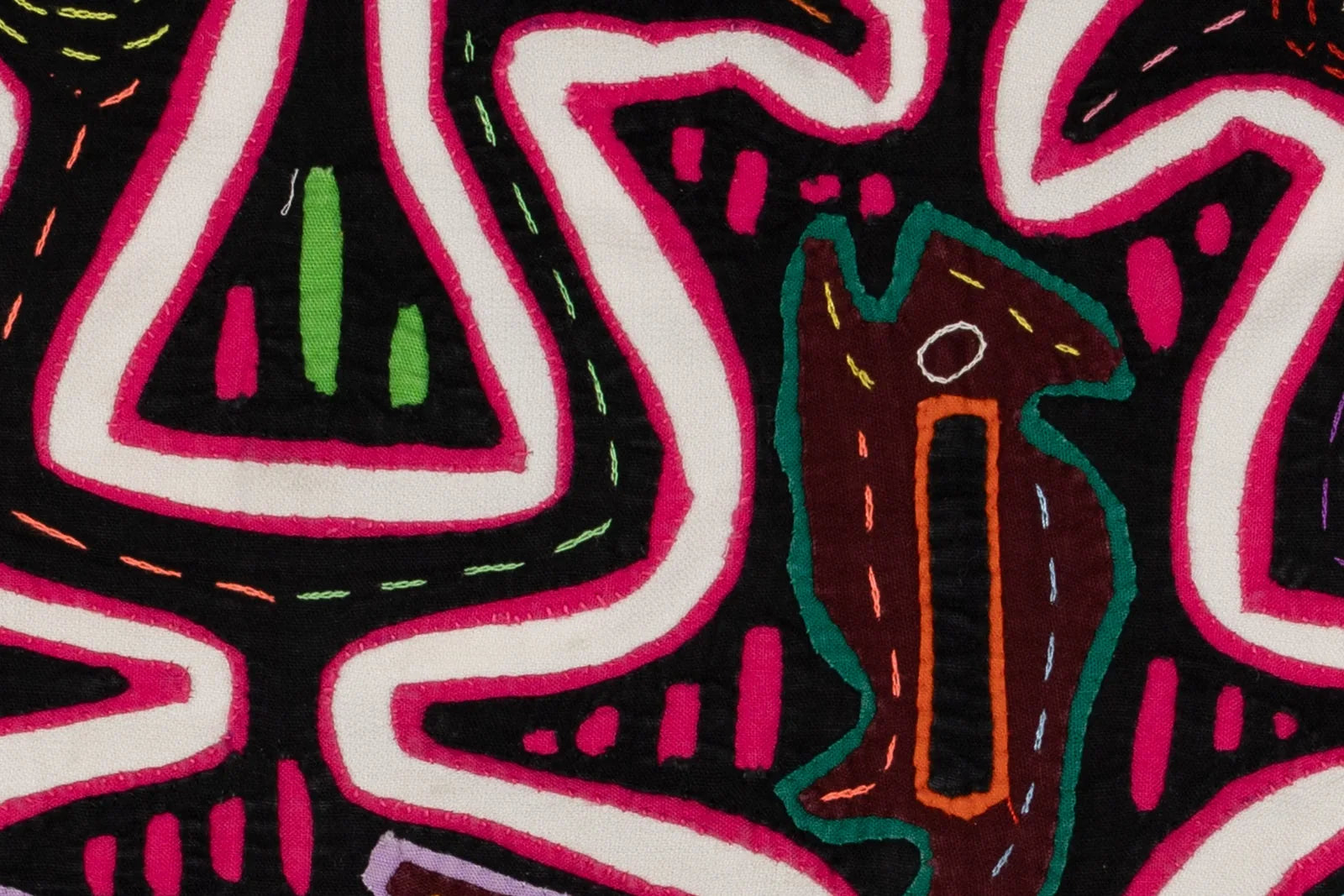 Hand-stitched black tapestry featuring vibrant pink and green geometric patterns and a stylized dog design.