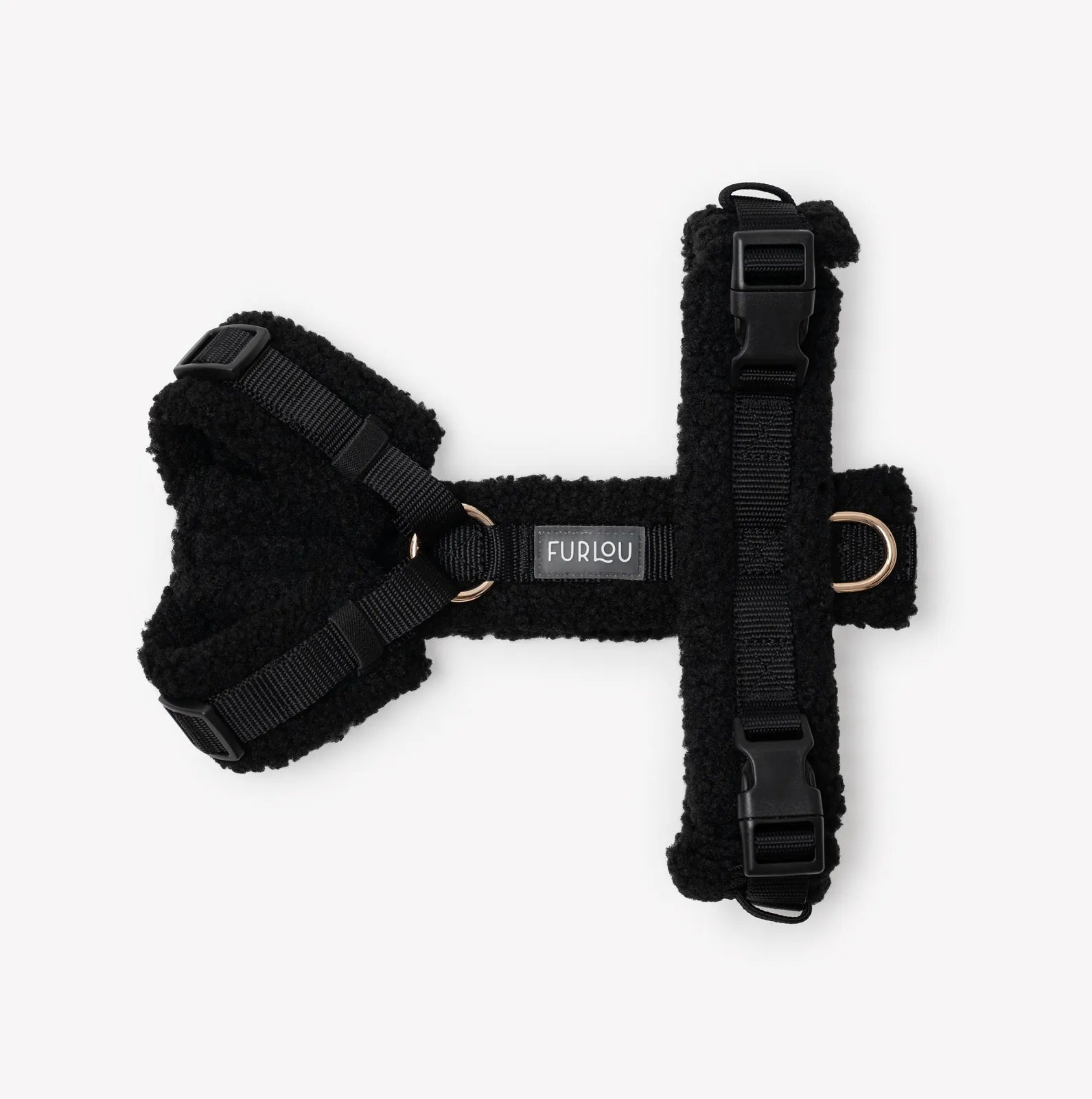 Black sherpa dog harness by FURLOU featuring fluffy lining, adjustable straps, and subtle gold details for comfort and style.