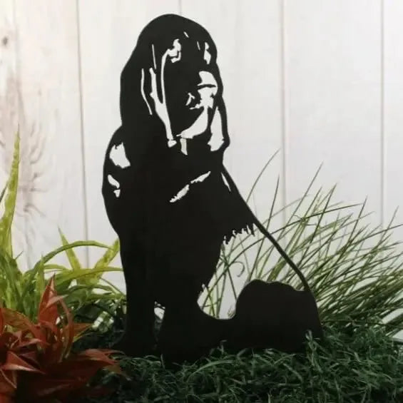 Black metal silhouette of a Bloodhound standing on grass, showcasing intricate details and a clean design.