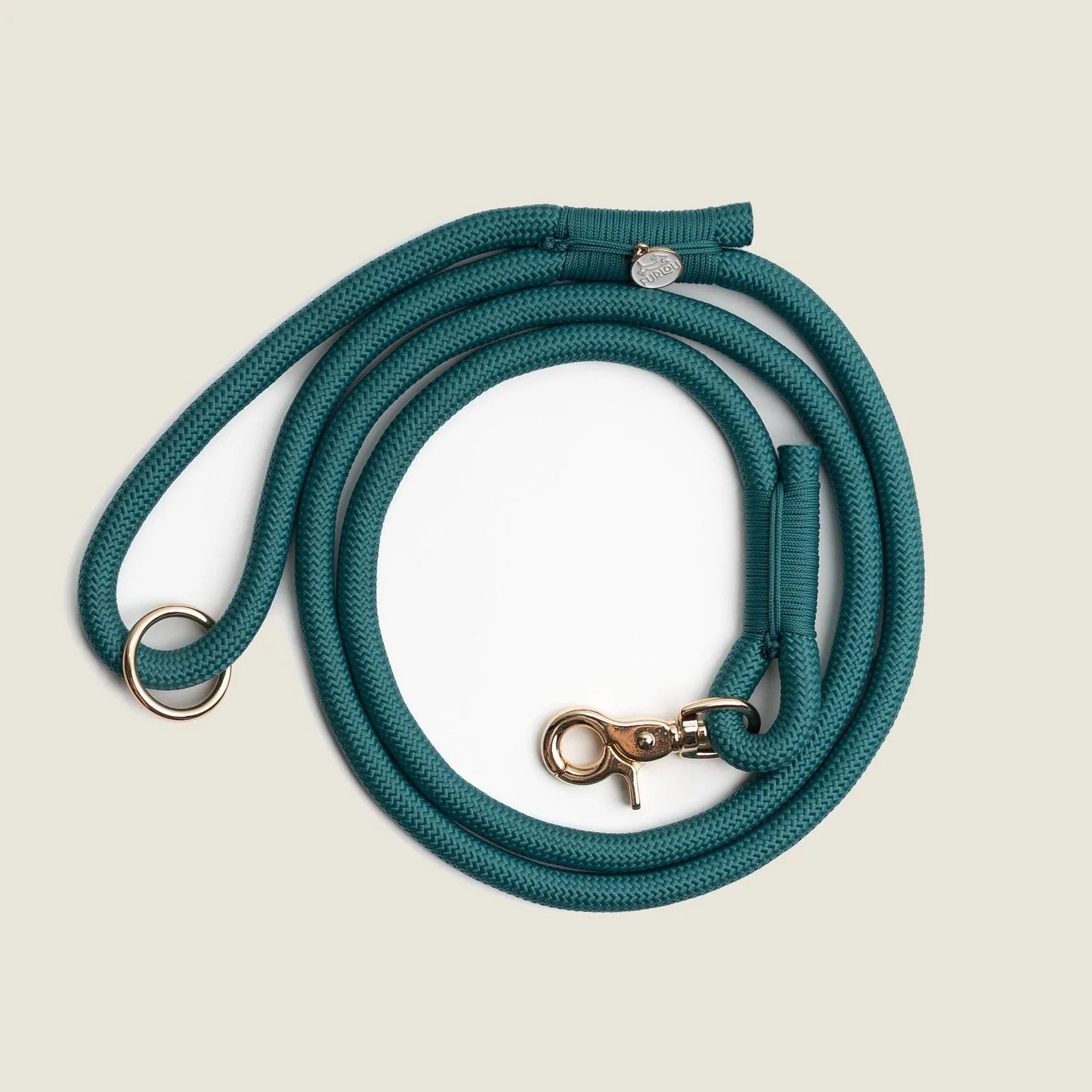 Teal braided rope leash by FURLOU with reinforced stitching and gold clip for secure walks.