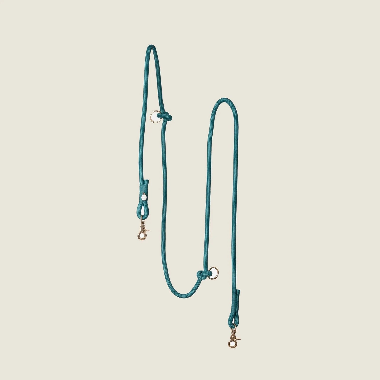 Hands-free braided leash in teal, featuring two clips and adjustable design for convenience during walks or runs.