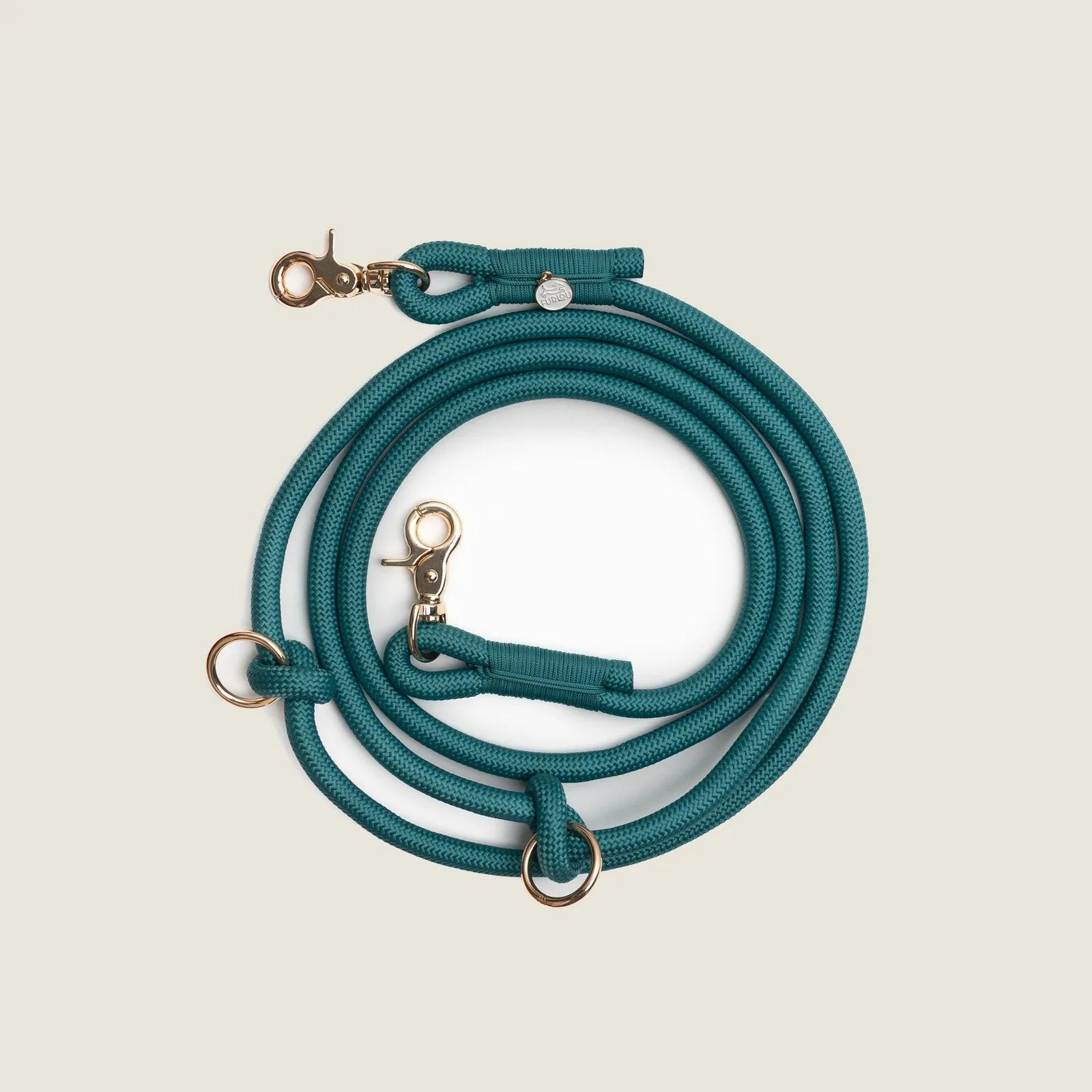 Braided hands-free leash in blue with gold clip attachments, designed for comfortable dog walking.