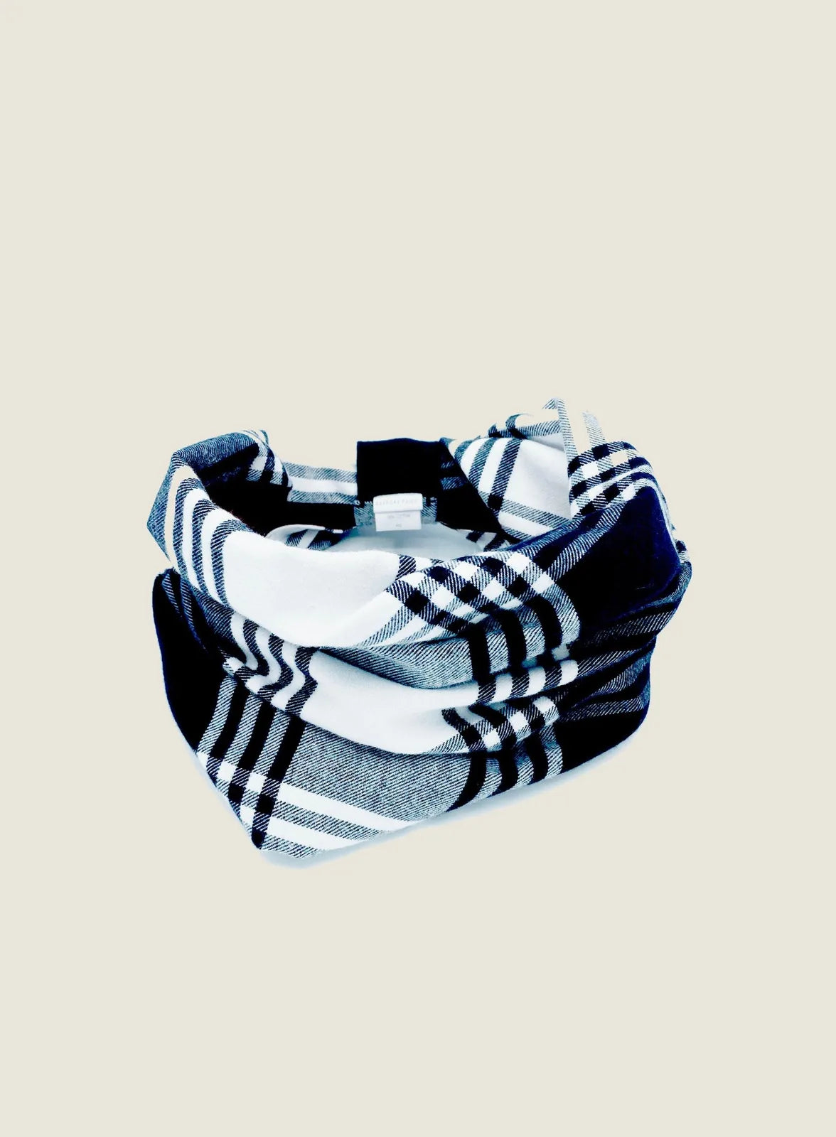 Reversible dog snood in black, white, and gray plaid pattern, crafted from soft brushed cotton flannel.