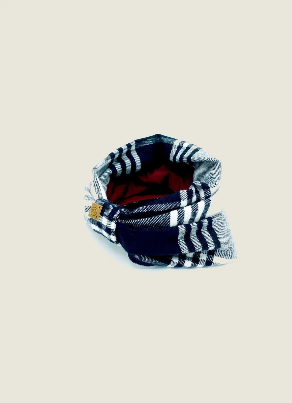Reversible dog snood in navy and grey plaid with a soft red interior, crafted from cozy brushed cotton flannel.