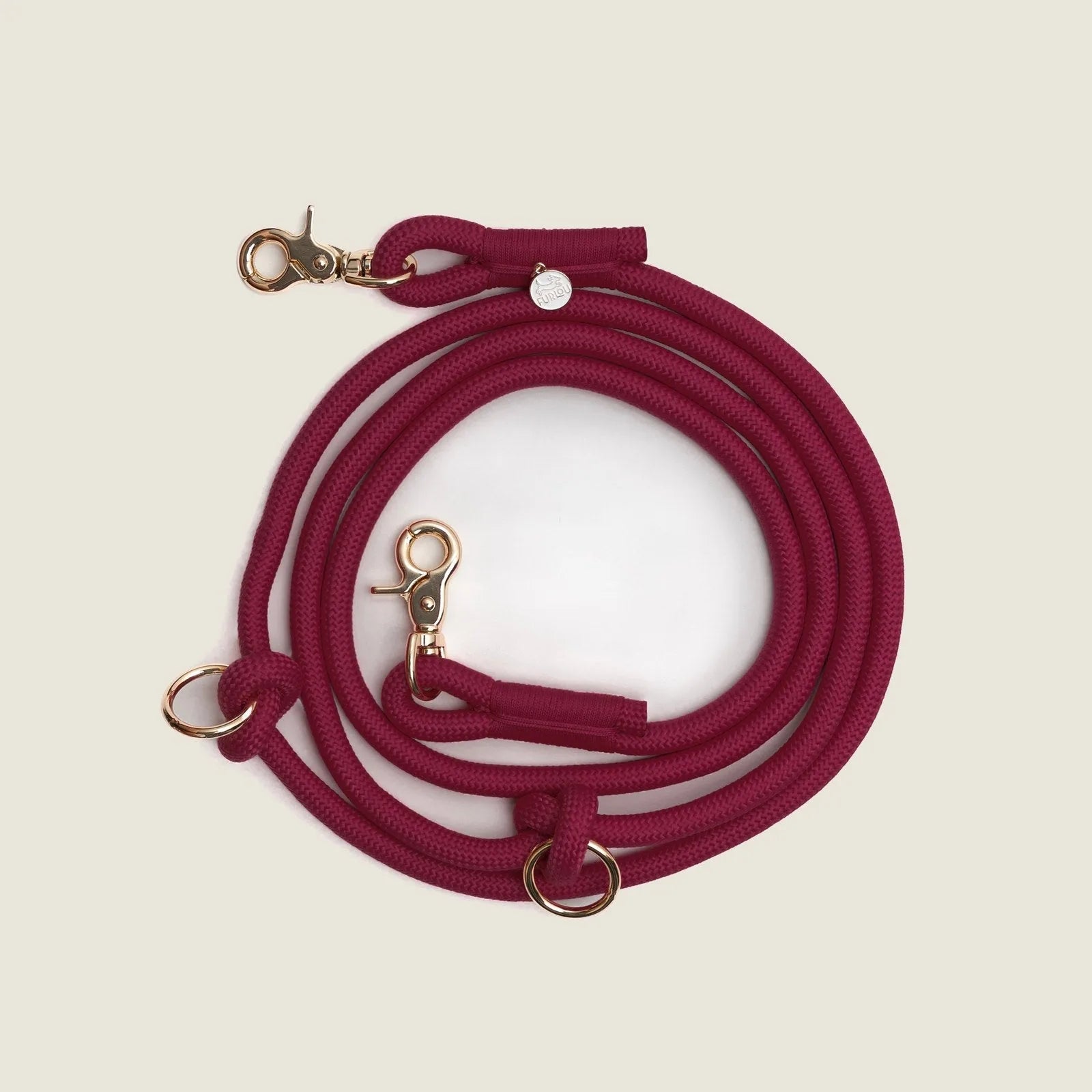 Hands-free braided leash in Bordeaux with gold clips, designed for comfort and style during dog walks.