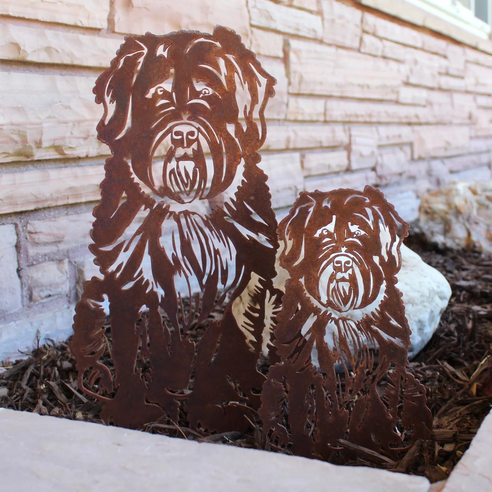 Bouvier Des Flandres metal silhouettes in rust patina, showcasing intricate designs, placed in outdoor decor setting.