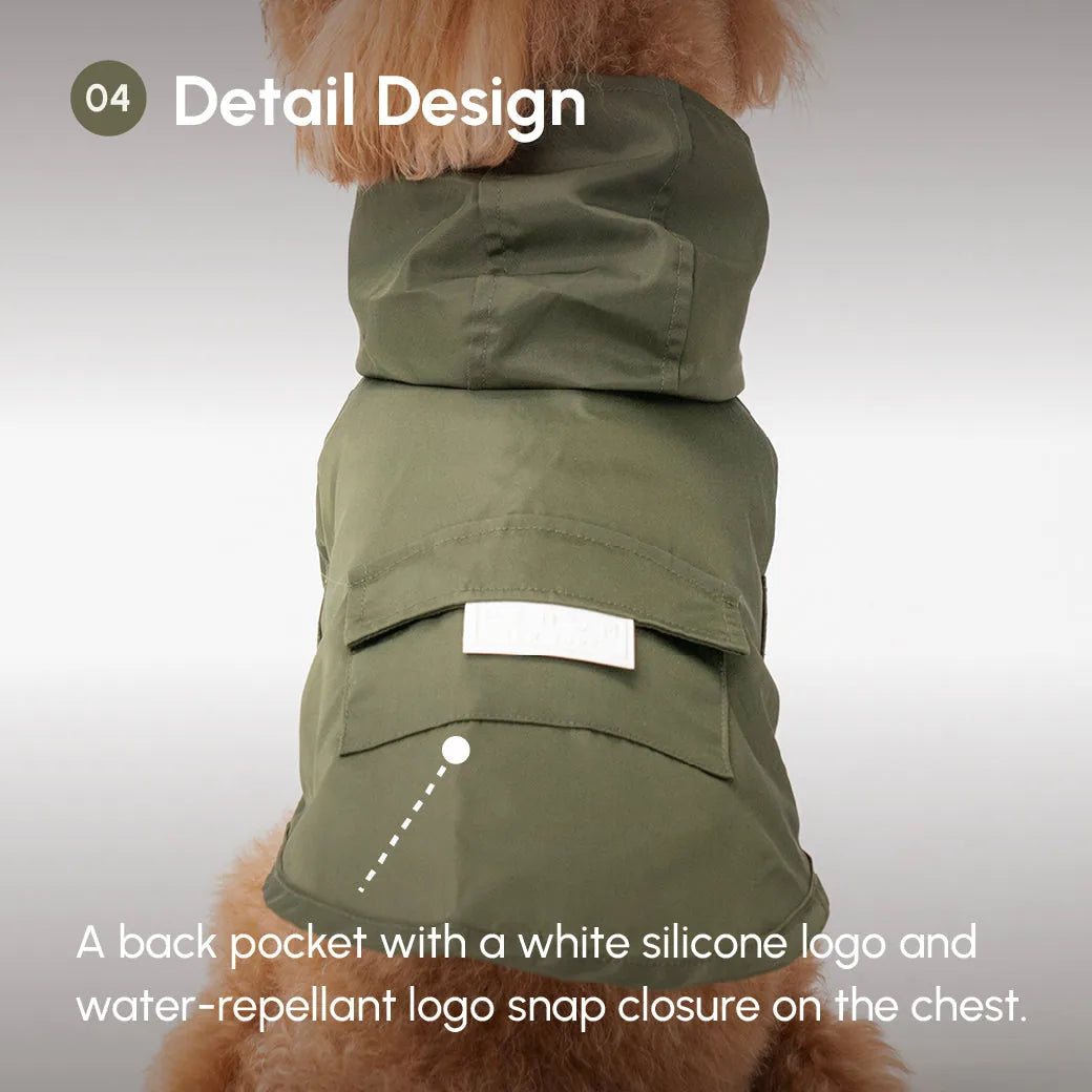 Green water-repellant dog raincoat featuring a back pocket with white logo and snap closure on the chest.