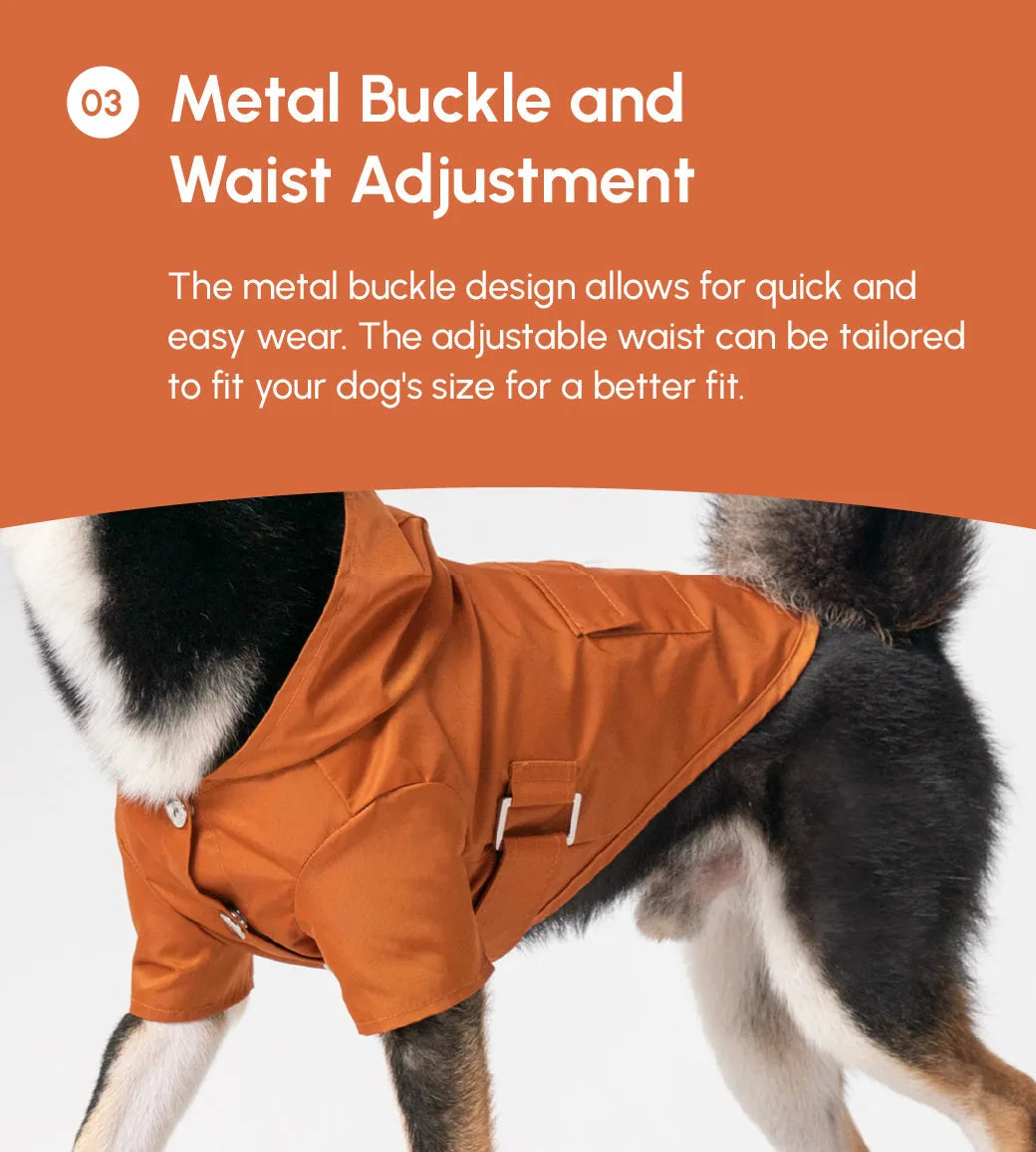 Bright orange Bowery raincoat for dogs featuring a hood, metal buckle, and adjustable waist for a secure fit.
