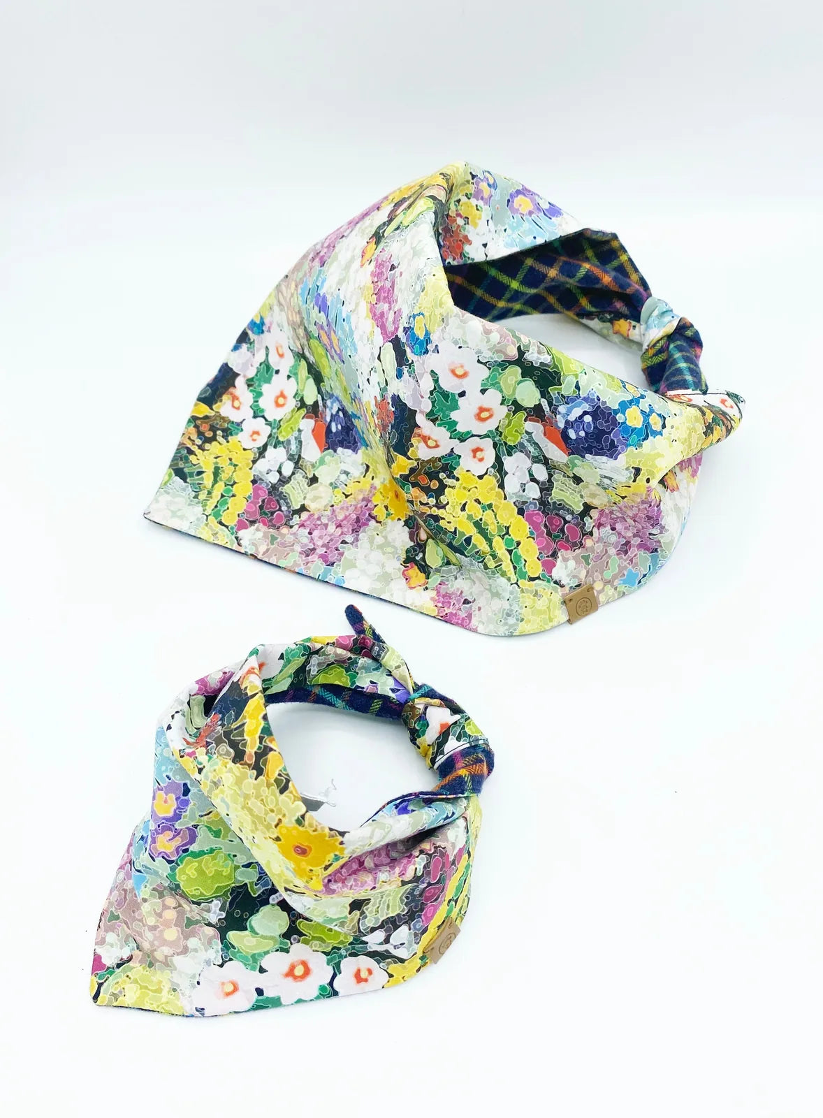 Reversible 'Brett' pet bandana in vibrant floral pattern, crafted from soft cotton flannel for stylish dog accessories.