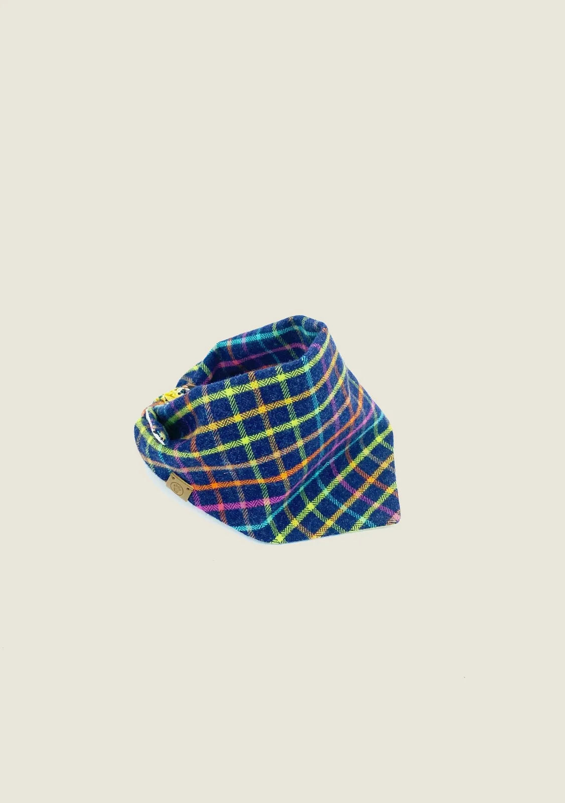 Reversible pet bandana in a vibrant blue and plaid pattern, crafted from soft, lightweight cotton flannel.