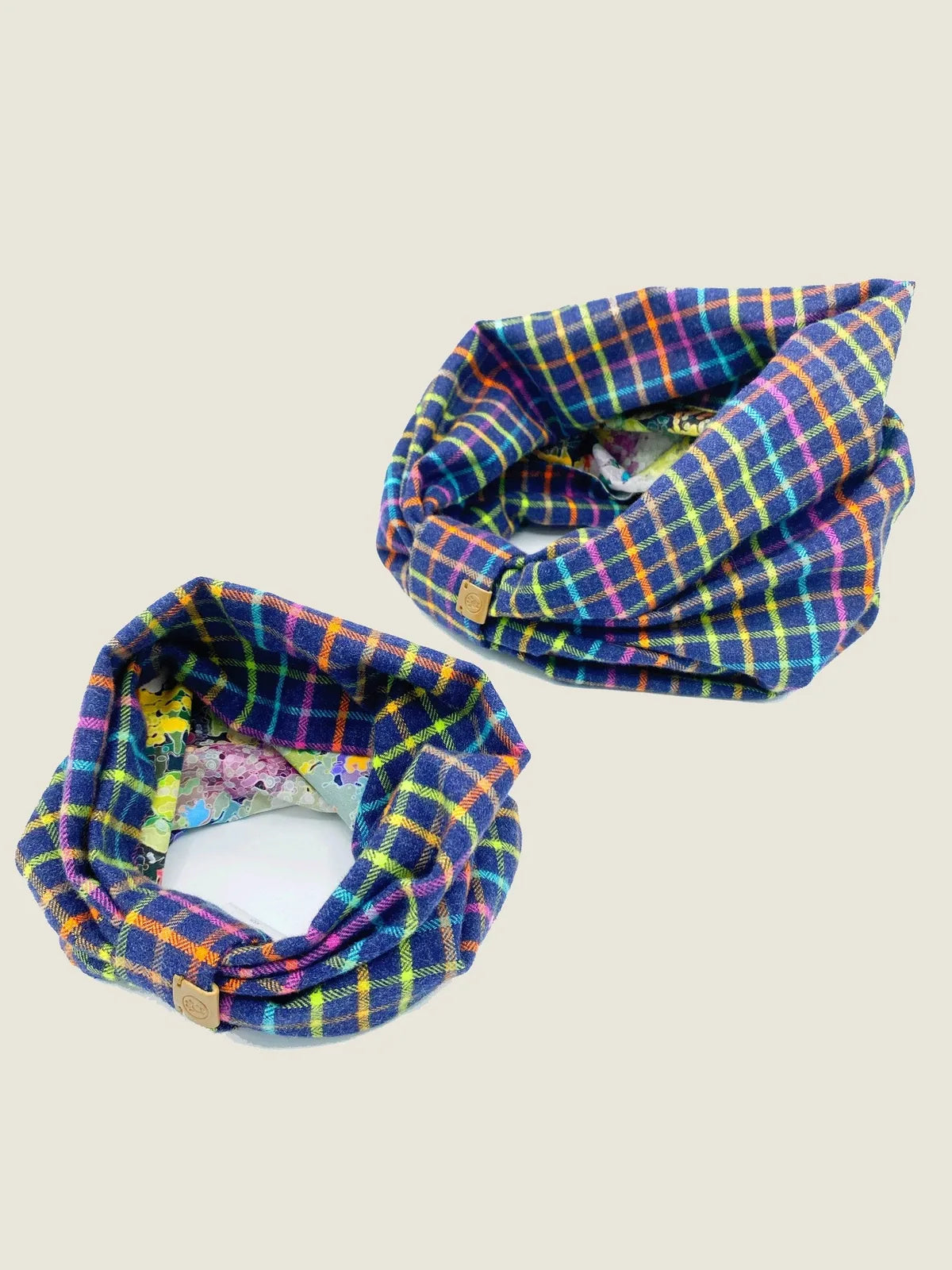 Reversible pet snood in blue plaid with colorful accents, showcasing soft brushed cotton flannel, perfect for stylish dog...