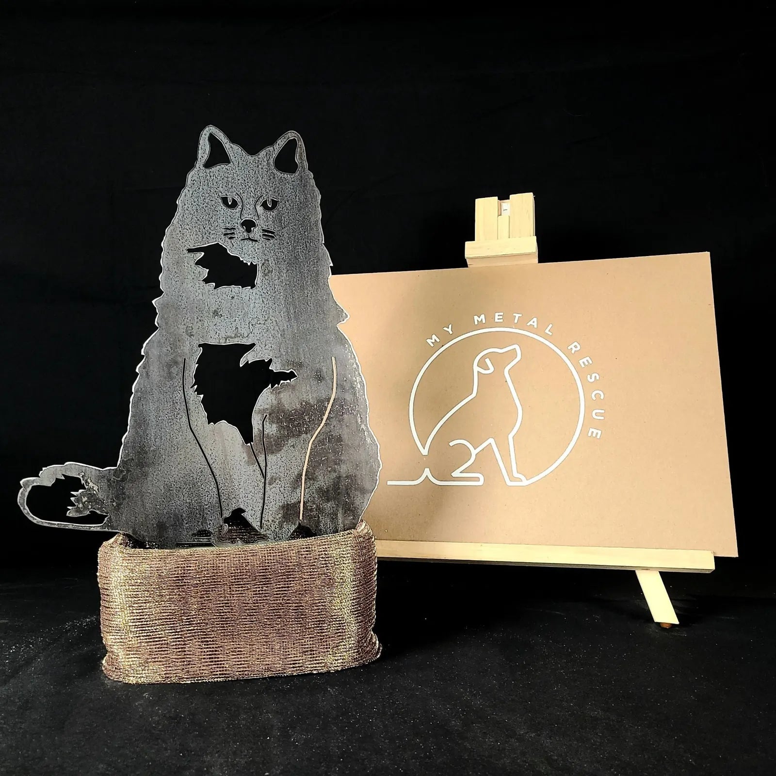 Handmade corten steel silhouette of a British Longhair cat, displaying intricate details and a rustic finish.
