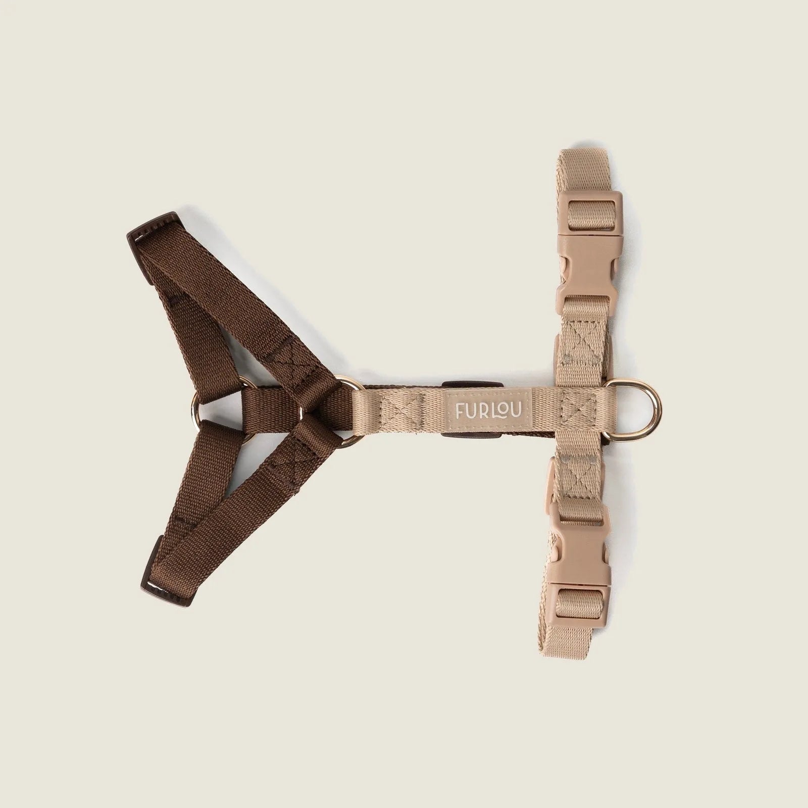 Brown and tan strap harness by FURLOU with gold hardware and five adjustment points for a custom fit.