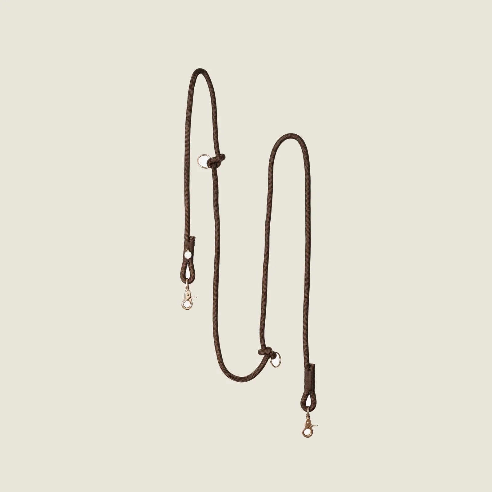 Hands-free braided leash in brown with durable clips, ideal for walking and jogging with your dog.
