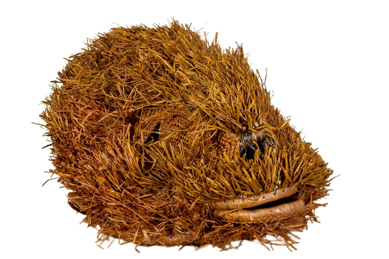 Handwoven brown Labradoodle mask featuring natural fibers and intricate textures, perfect for unique wall decor.