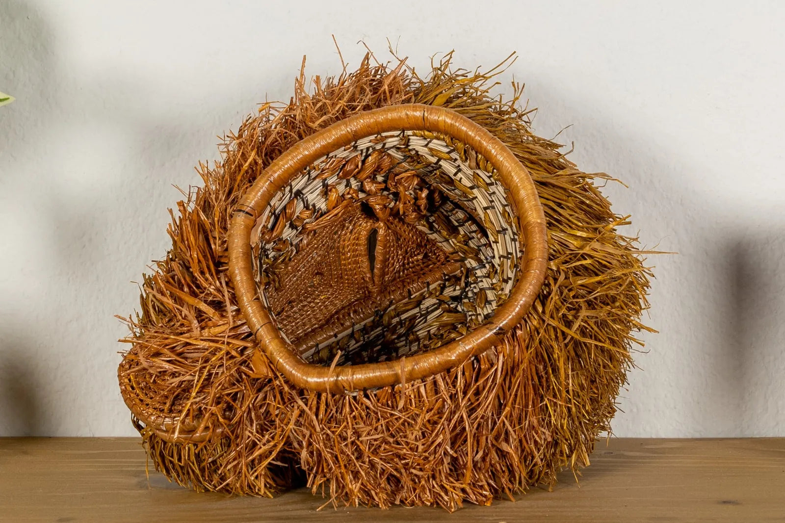 Handwoven Brown Labradoodle mask featuring natural browns and intricate textures, ideal for cultural home decor.
