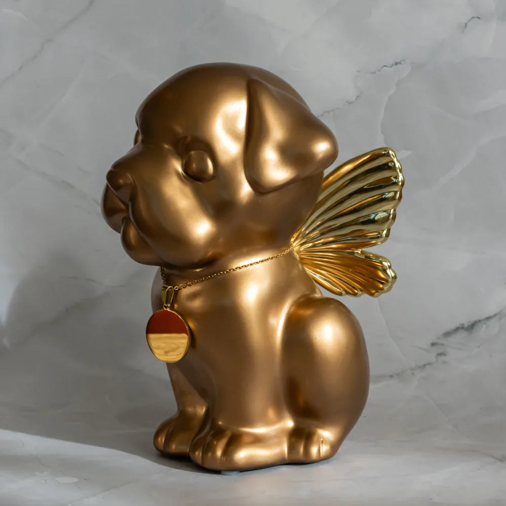 Handcrafted gold dog urn featuring angel wings, ideal for memorializing Bully breeds, standing 9 inches tall.