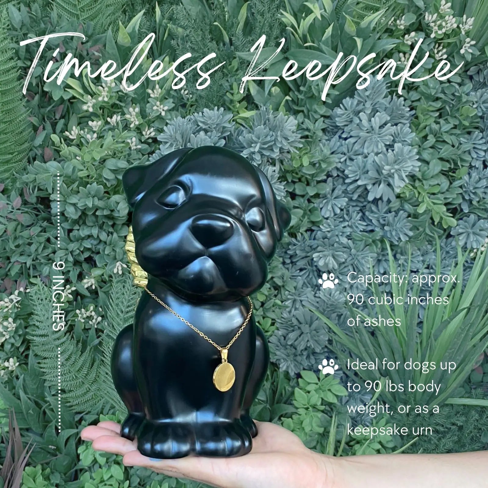 Handcrafted black urn in the shape of a Bully breed dog, adorned with gold wings and a pendant, ideal for memorializing pets.