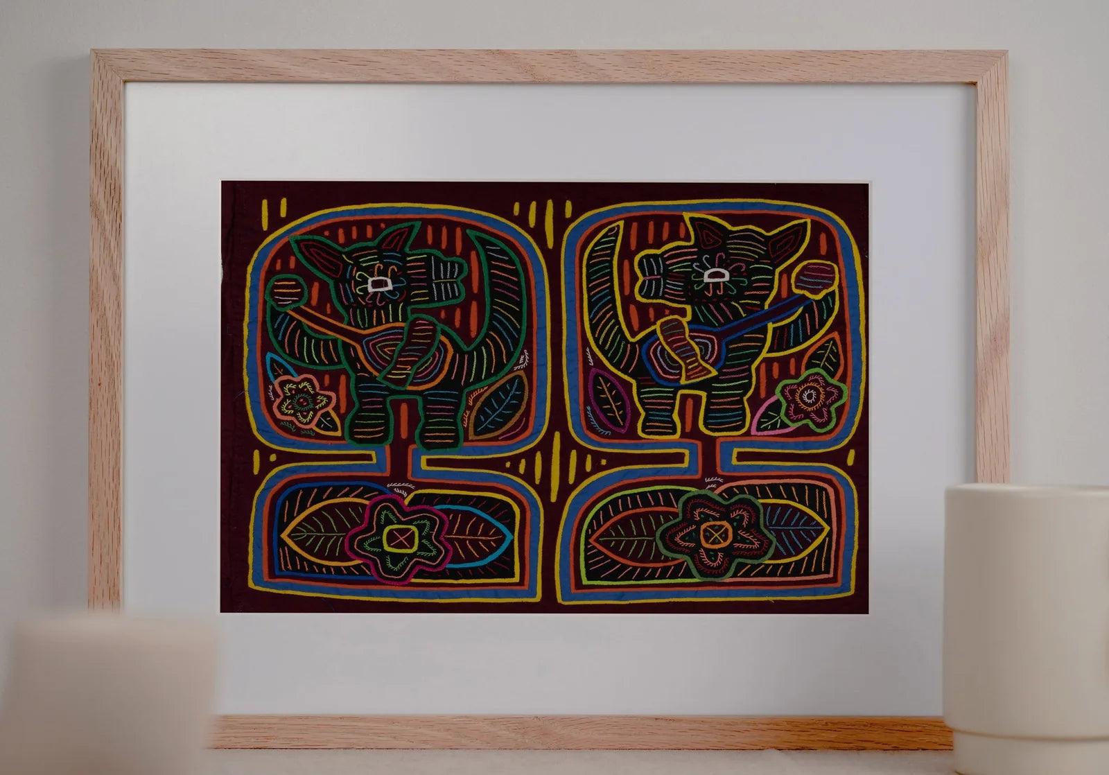 Burgundy decorative tapestry featuring playful puppies, vibrant colors, and floral patterns, handcrafted by Guna artisans.