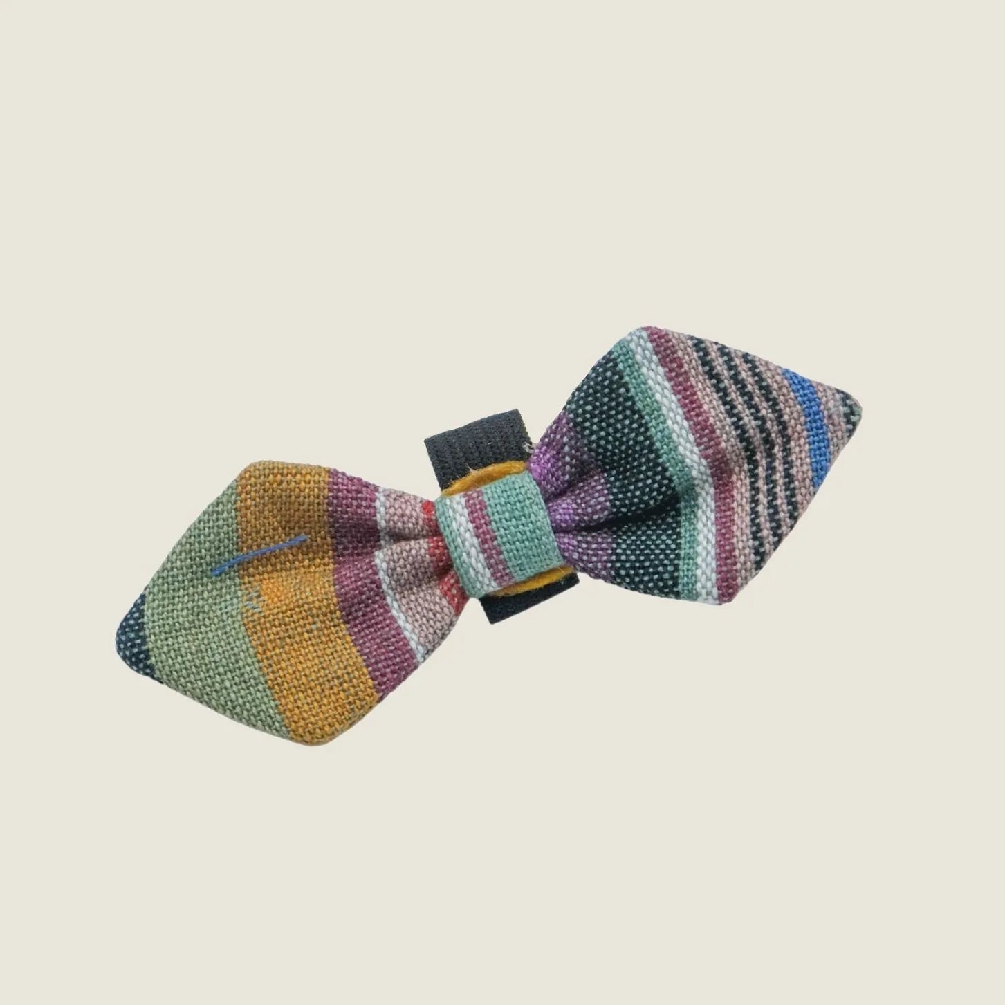 Handcrafted pet collar bow tie in vibrant, multicolored stripes with a secure attachment for style.