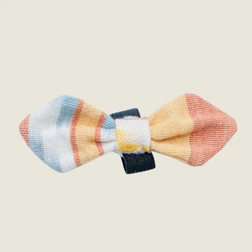 Colorful striped bow tie in soft fabric, designed to slip onto a pet's collar for stylish flair.
