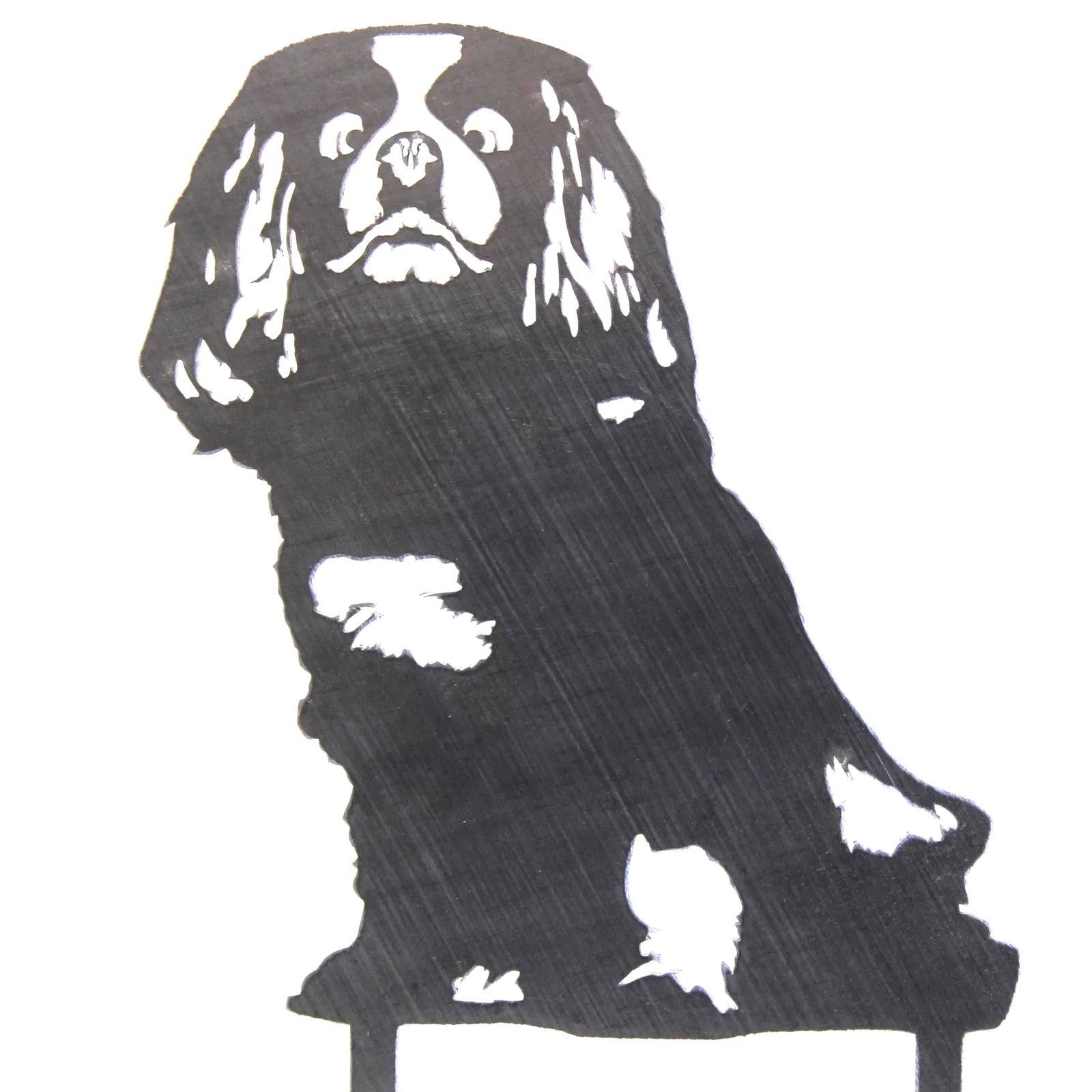 Cavalier King Charles Spaniel silhouette in matte black metal, showcasing detailed facial features and fur patterns.