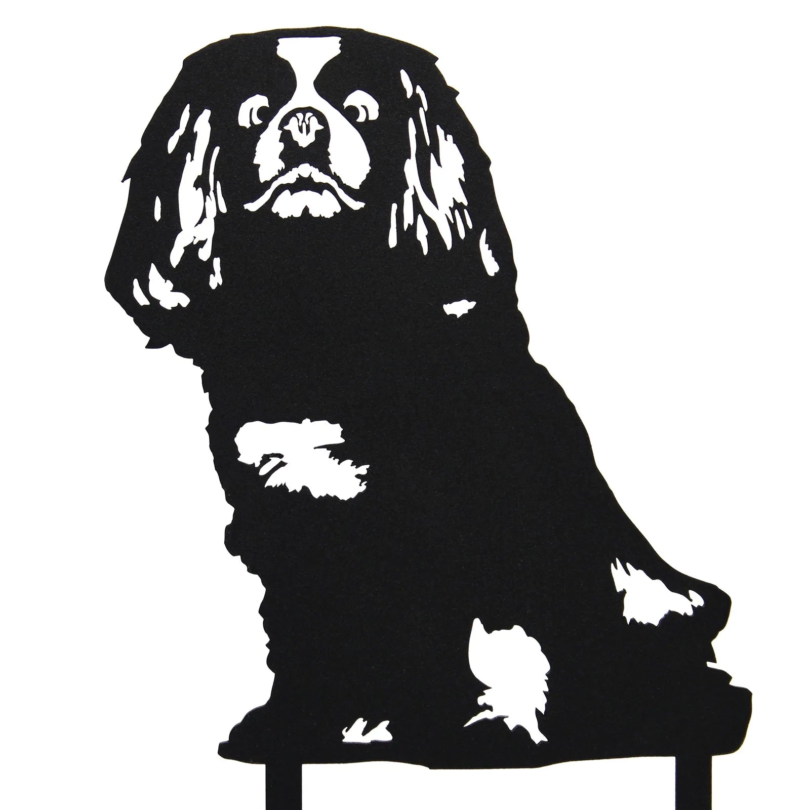 Black metal silhouette of a Cavalier King Charles Spaniel, showcasing intricate cutouts and detail in a sitting position.