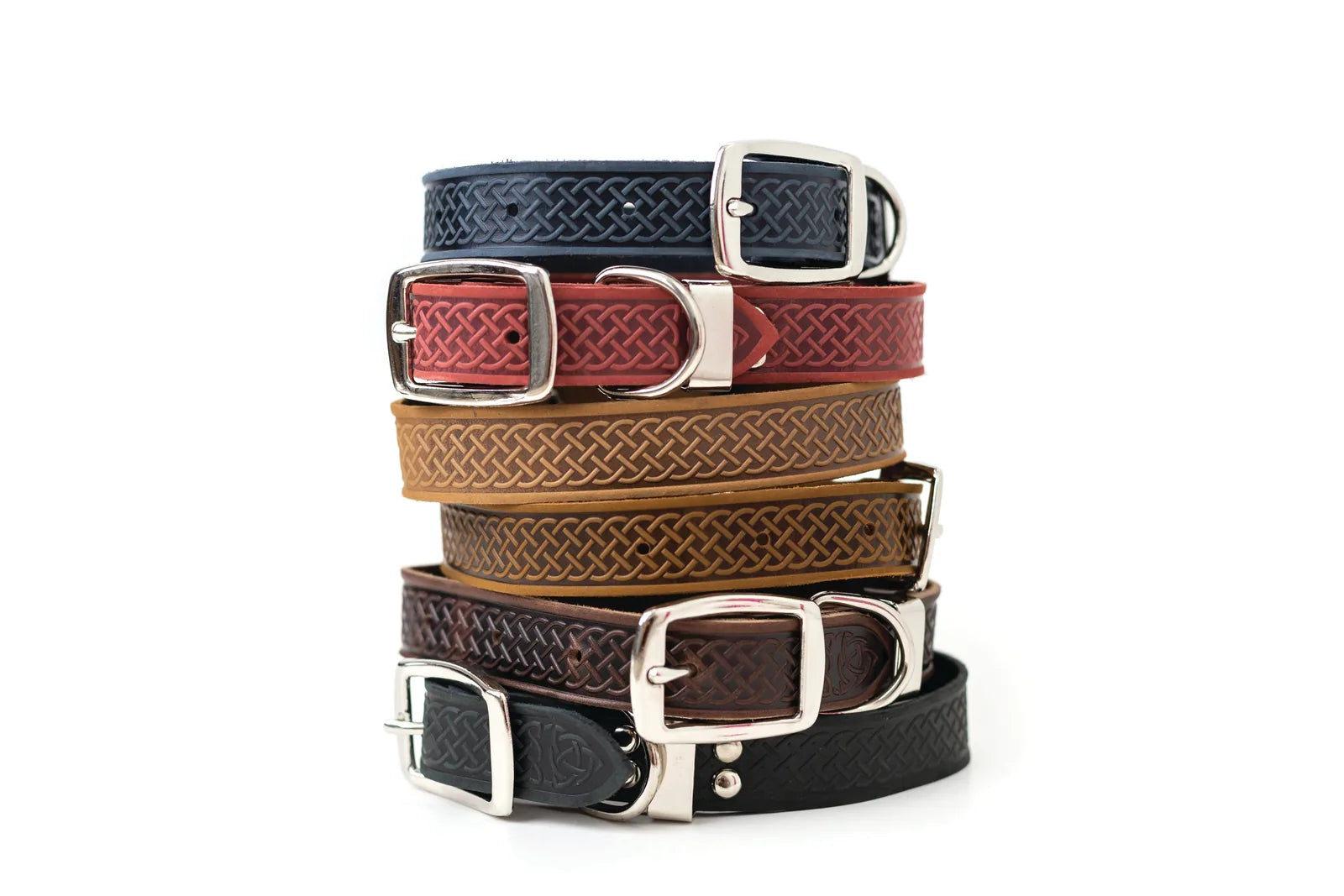 Stack of quality leather dog collars in various colors including navy, coral, tan, brown, and black, featuring Celtic design.