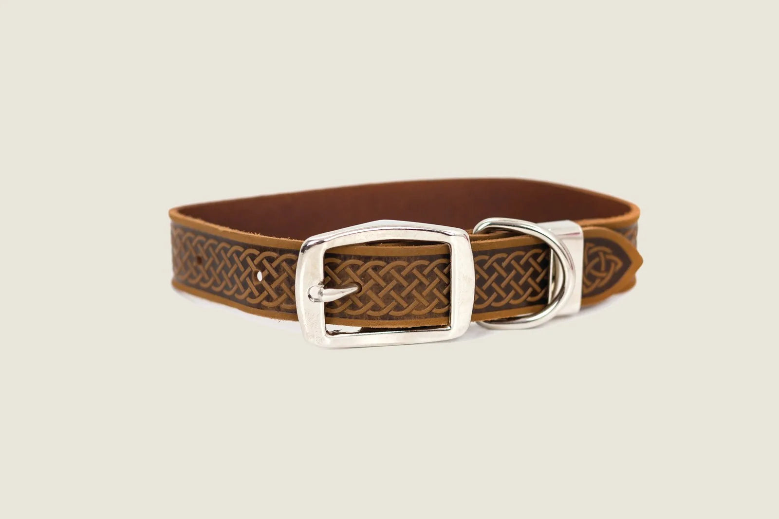Celtic design leather dog collar in bark brown with silver buckle and extra loop for secure fit.