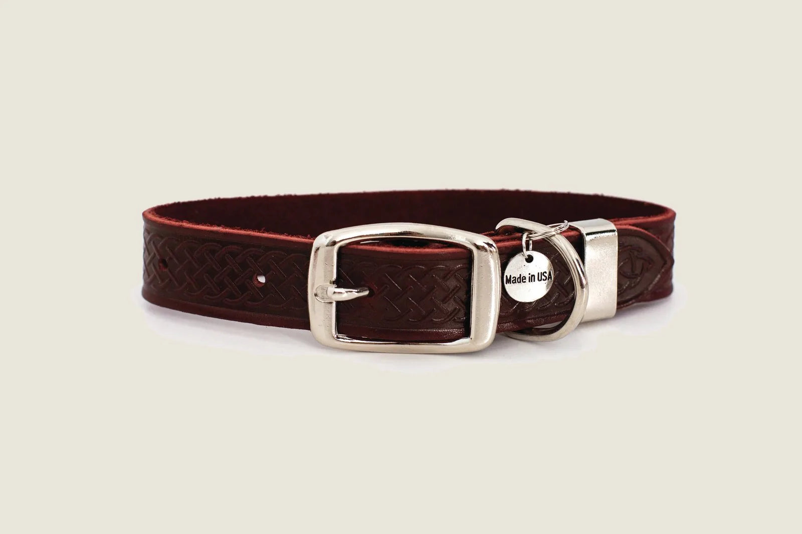 Bark brown leather dog collar with Celtic design, double-sided buckle, and metal loop for durability.