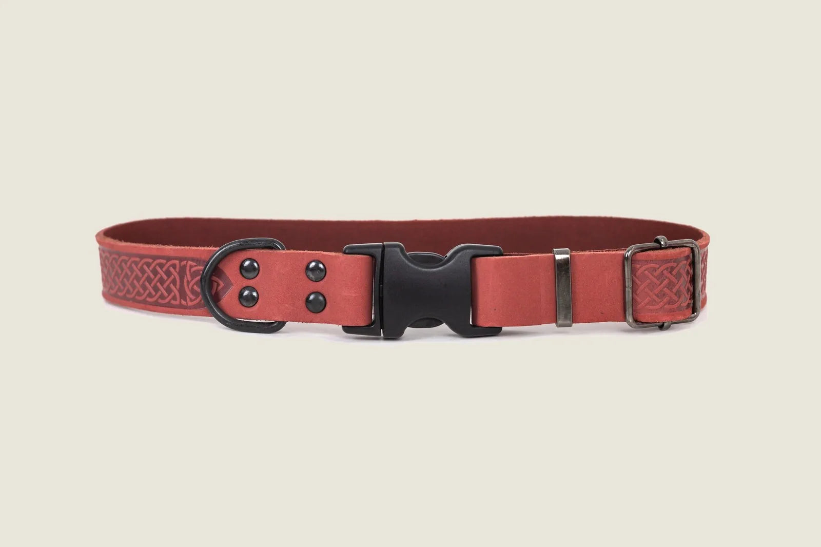 Celtic patterned coral reef leather dog collar with black hardware and quick-release buckle.