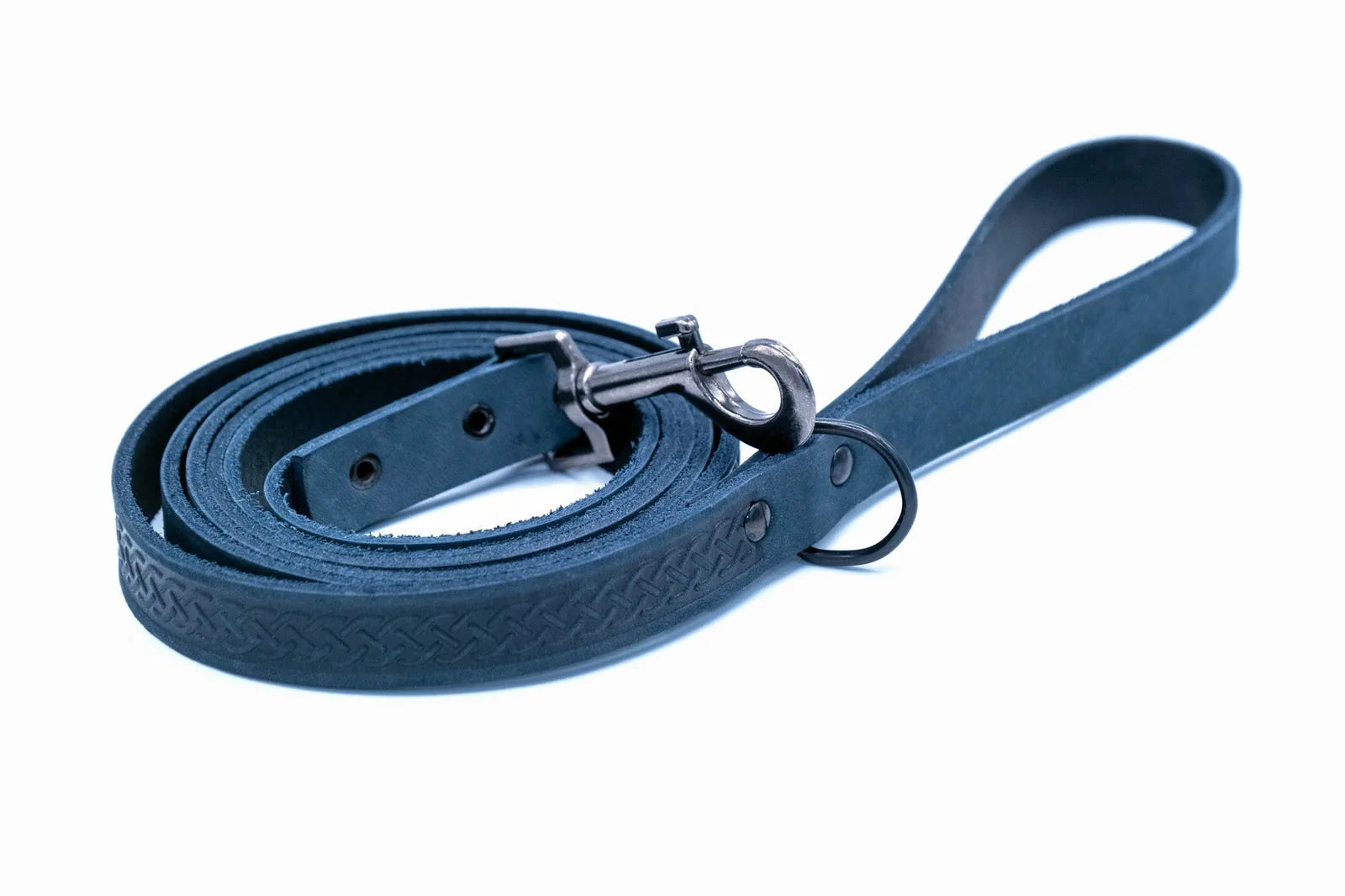 Navy leather dog leash with a braided design and metal clip, coiled and ready for use.
