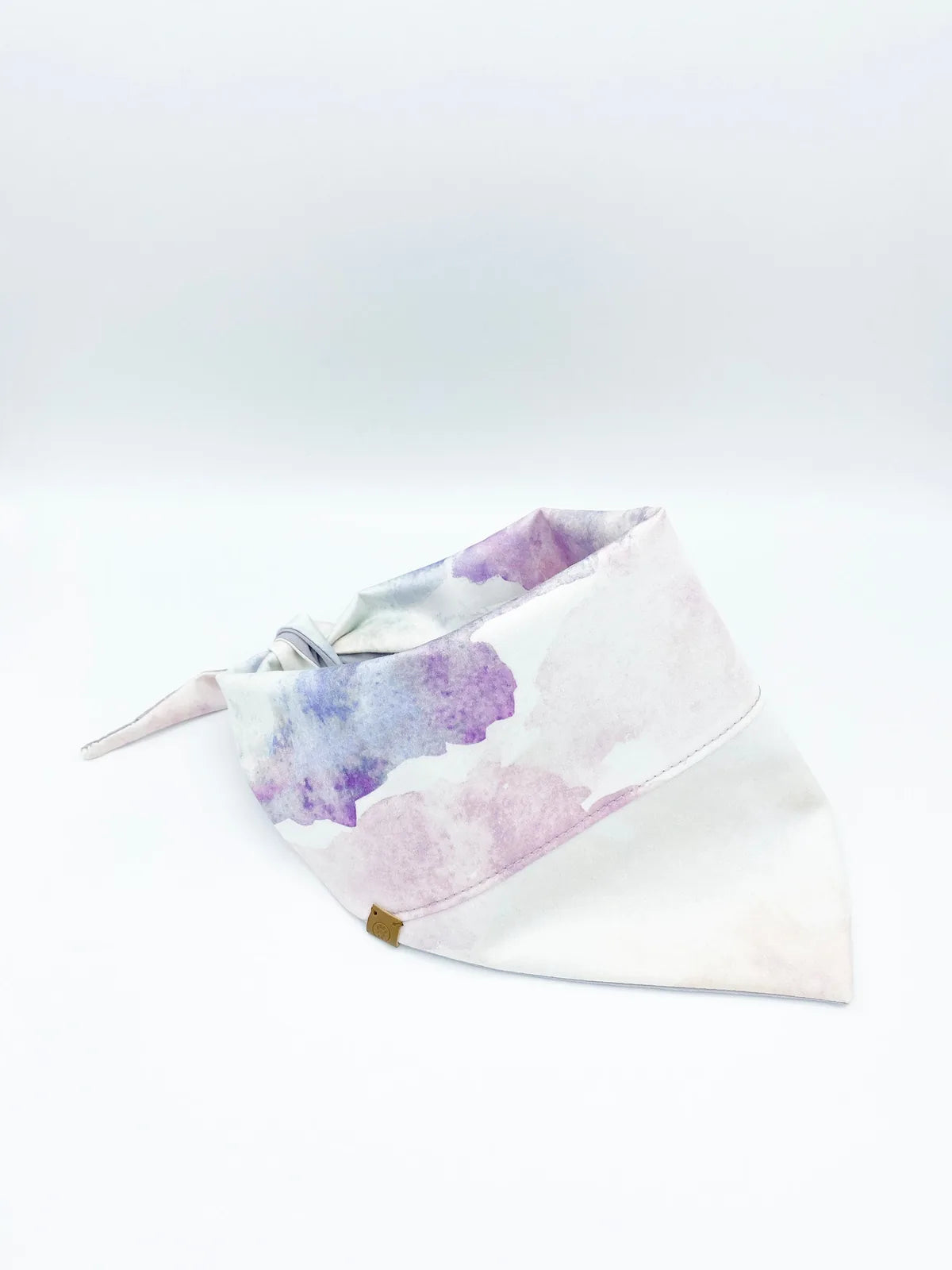 Reversible pink tie-dye and lilac pet bandana made of soft, breathable cotton by BESPOKE PAWS.